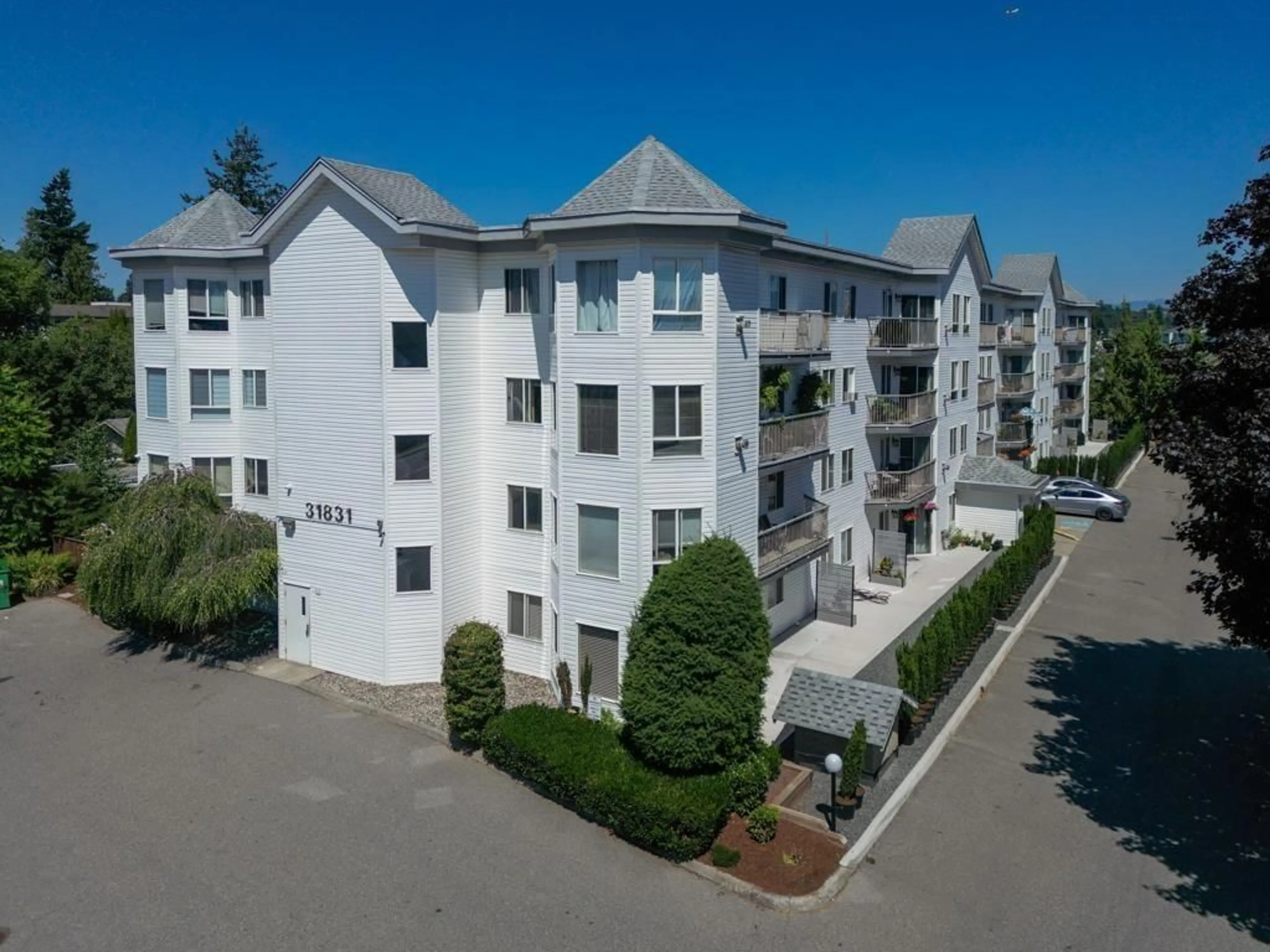 A pic from outside/outdoor area/front of a property/back of a property/a pic from drone, unknown for 410 - 31831 PEARDONVILLE, Abbotsford British Columbia V2T1L5