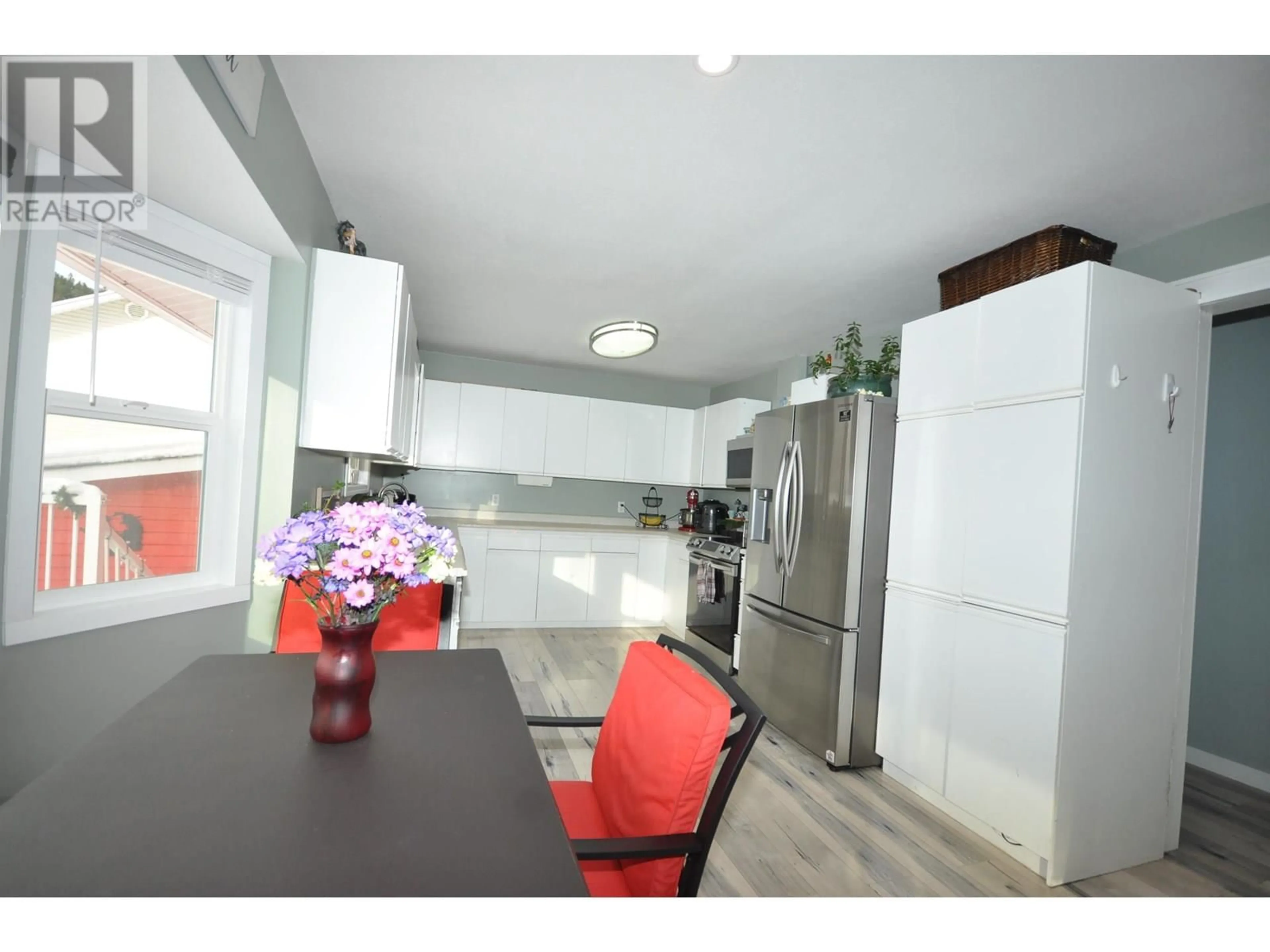 Open concept kitchen, wood/laminate floor for 2484 BAILEY ROAD, Williams Lake British Columbia V2G5B9