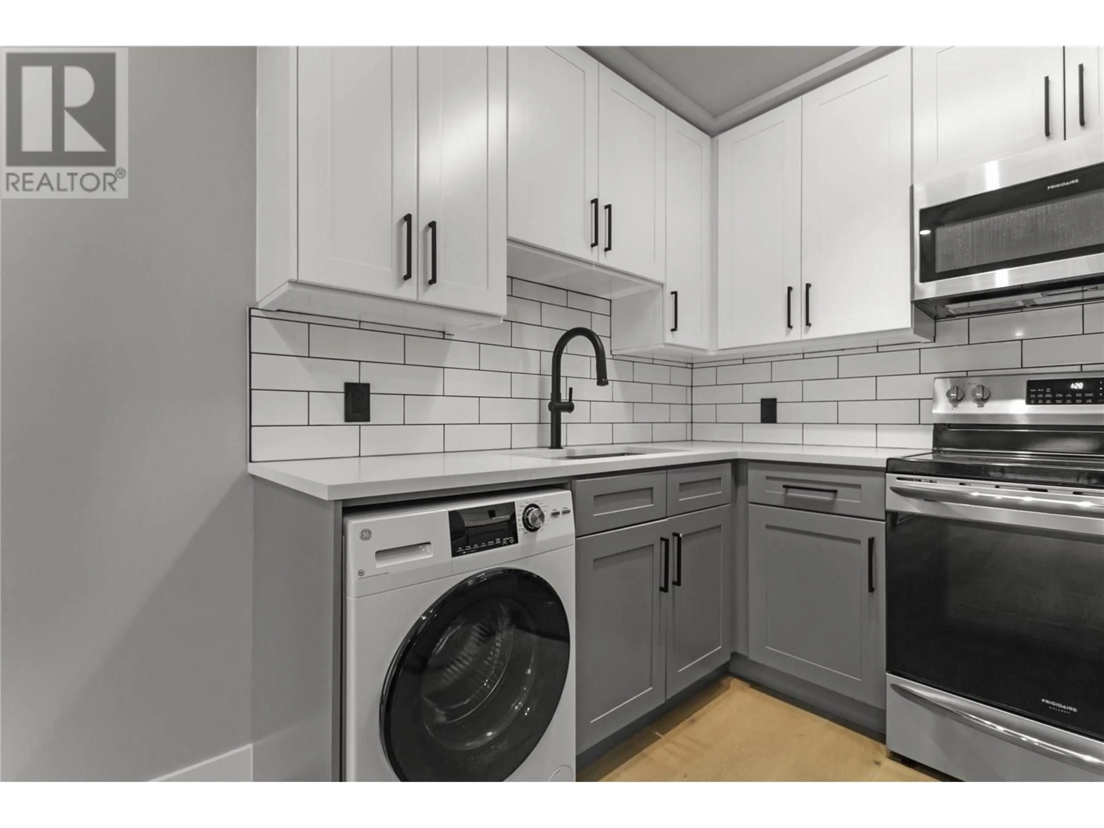 Kitchen with laundary machines, ceramic/tile floor for 201 - 1948 COQUITLAM AVENUE, Port Coquitlam British Columbia V3B1J3