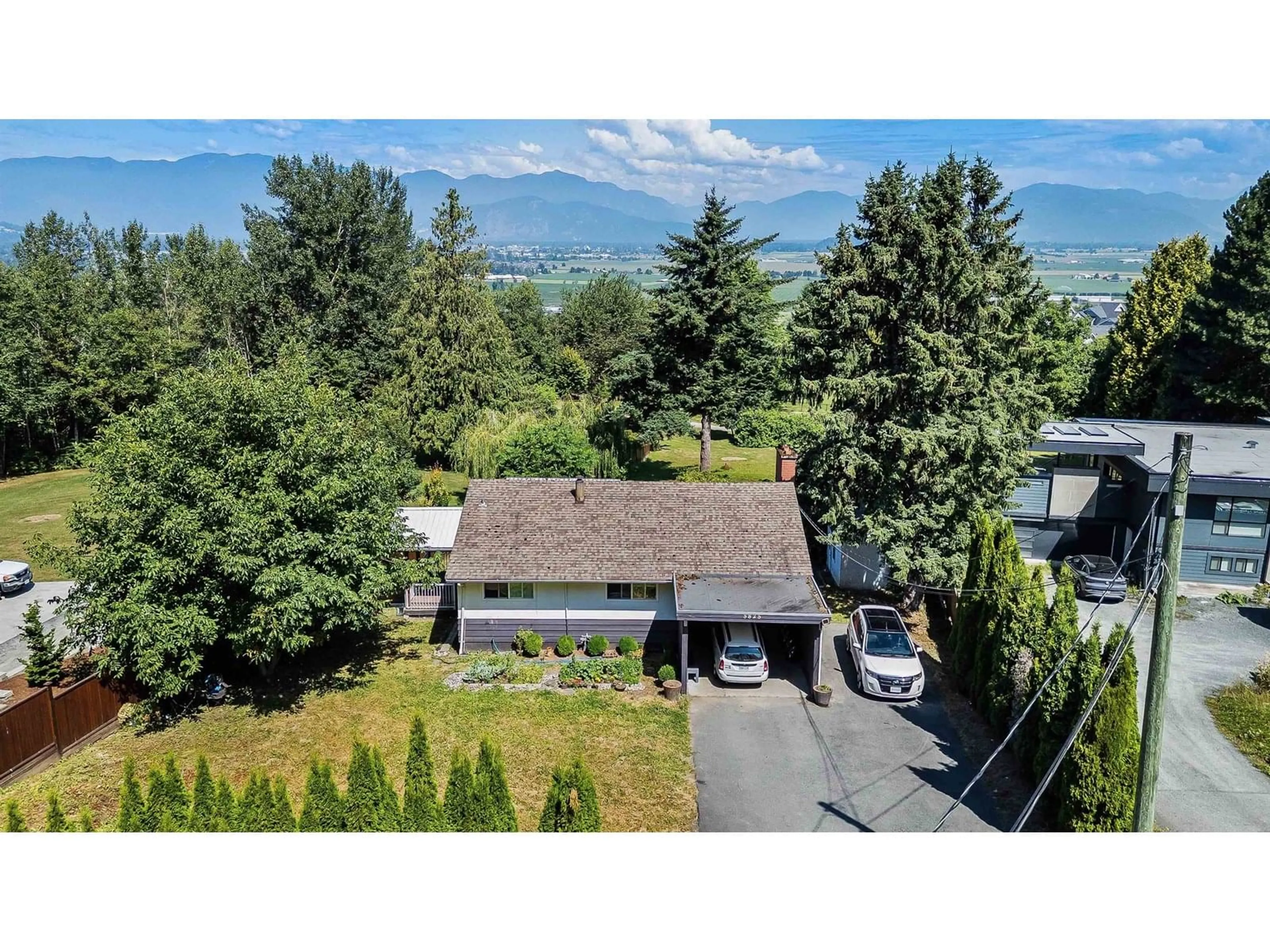 A pic from outside/outdoor area/front of a property/back of a property/a pic from drone, mountain view for 5825 JINKERSON ROAD, Chilliwack British Columbia V2R0C8