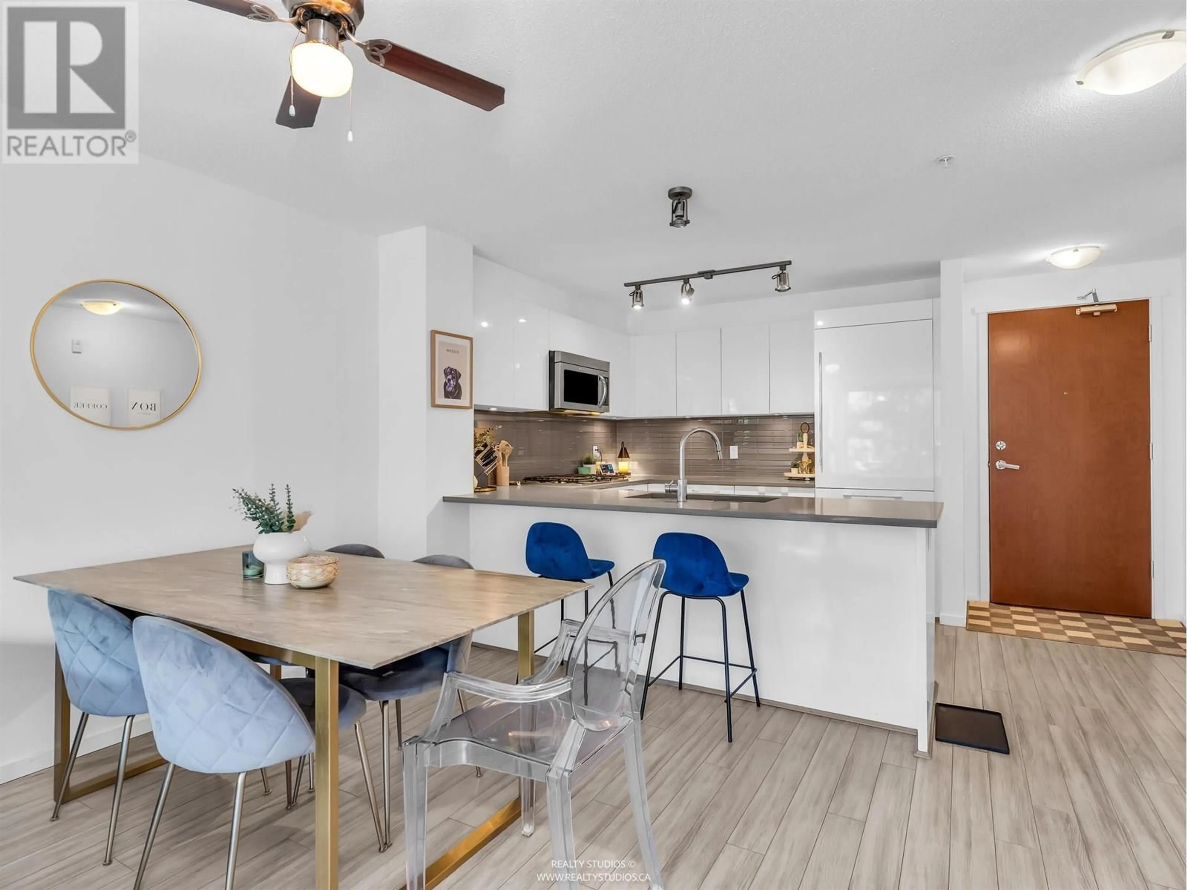 Open concept kitchen, wood/laminate floor for 202 - 1128 KENSAL PLACE, Coquitlam British Columbia V3B0J2