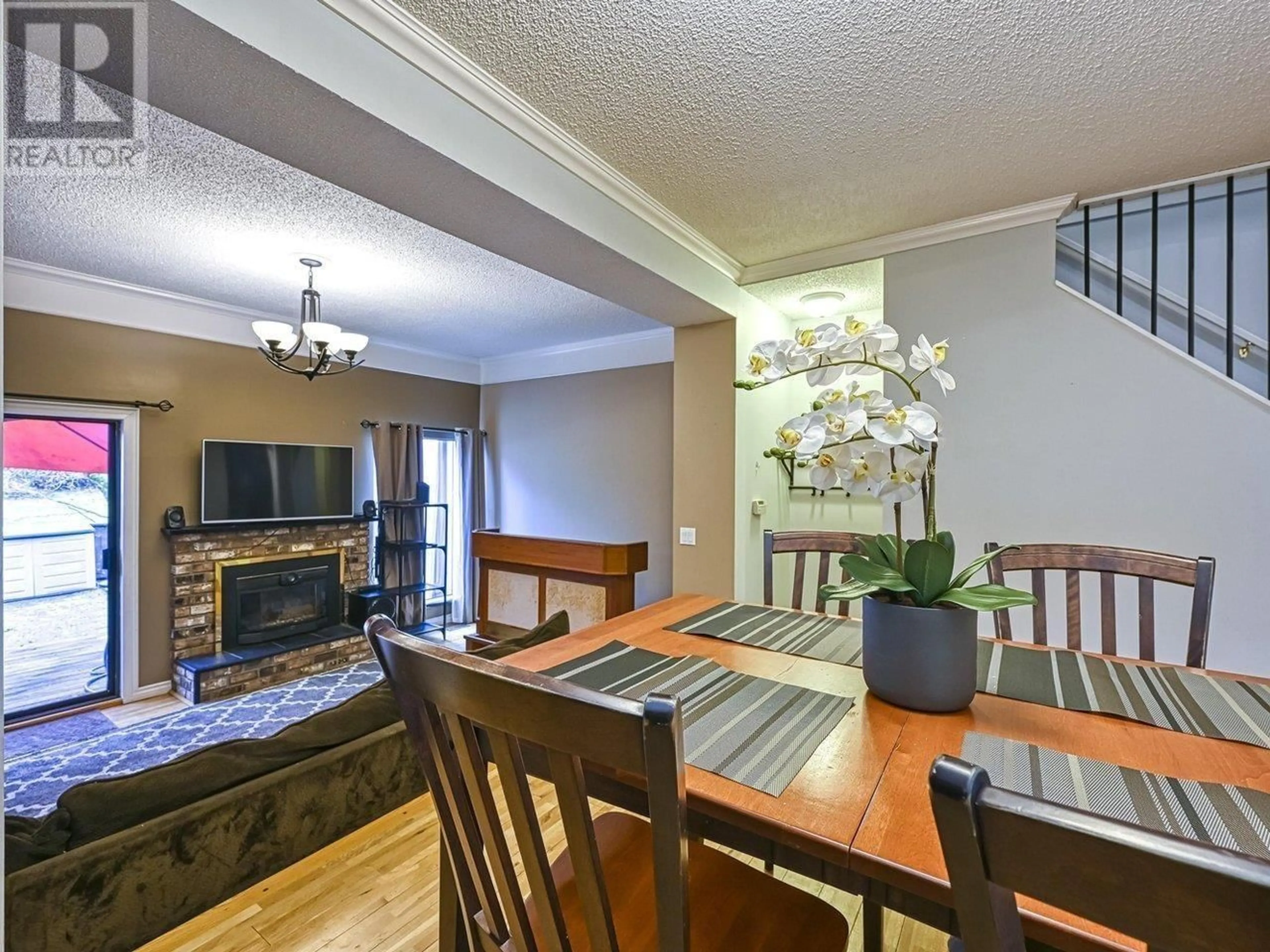 Living room with furniture, wood/laminate floor for 8 - 2980 MARINER WAY, Coquitlam British Columbia V3C4K1