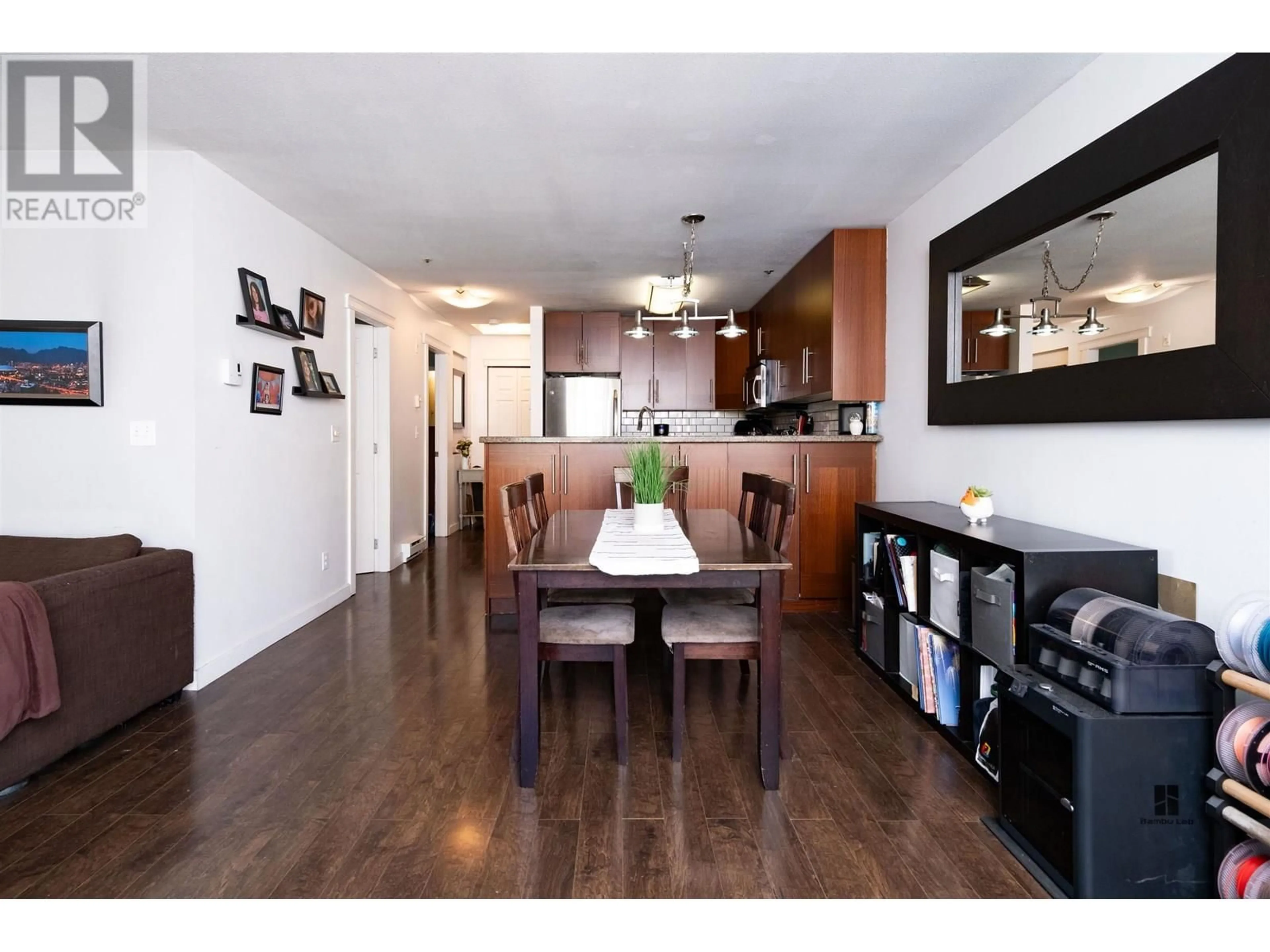 Open concept kitchen, wood/laminate floor for 403 - 118 2ND STREET, North Vancouver British Columbia V7L1C3