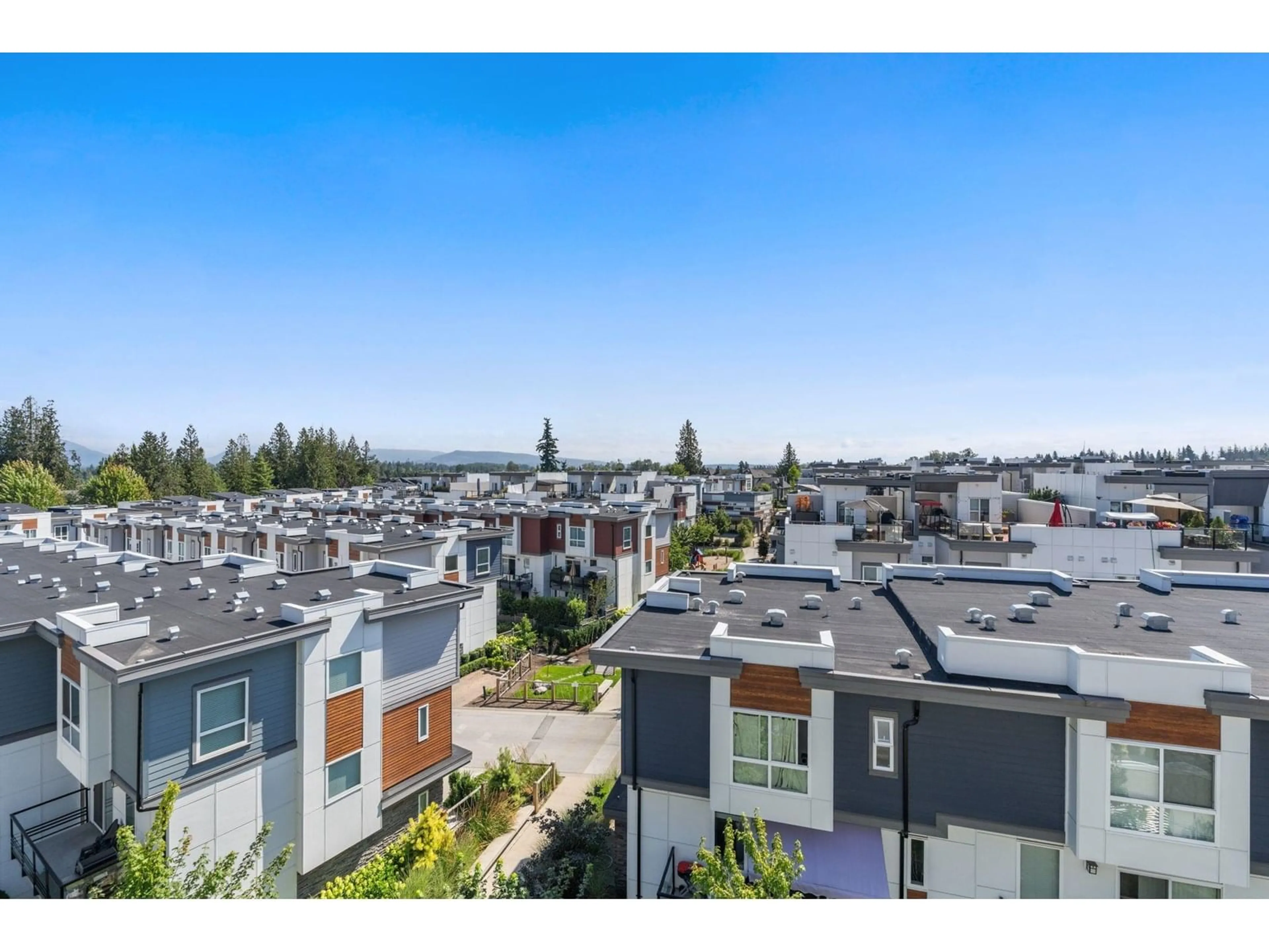 A pic from outside/outdoor area/front of a property/back of a property/a pic from drone, city buildings view from balcony for A516 - 20834 80, Langley British Columbia V2Y3M4