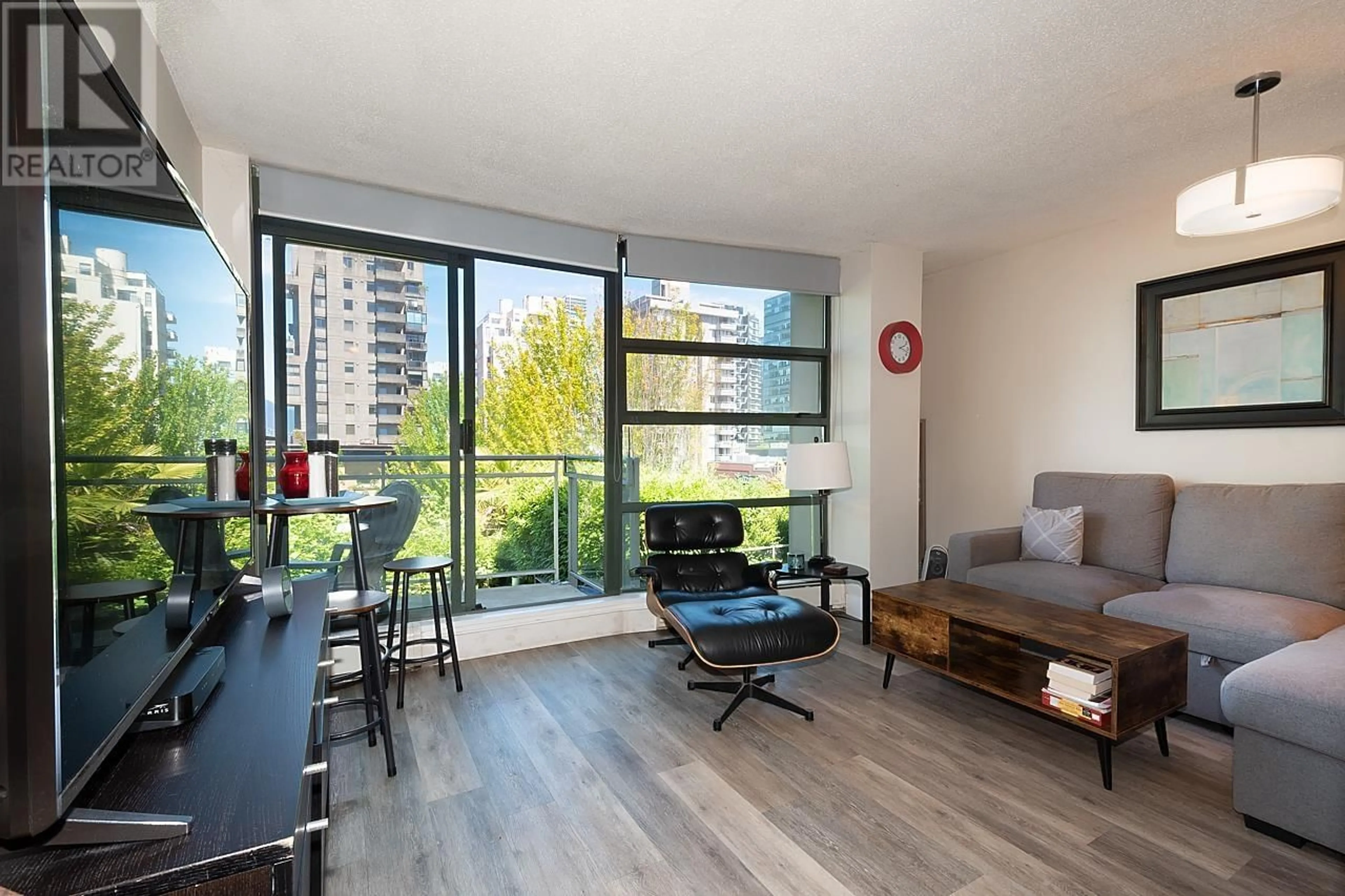 Living room with furniture, wood/laminate floor for 305 - 1688 ROBSON STREET, Vancouver British Columbia V6G1C7