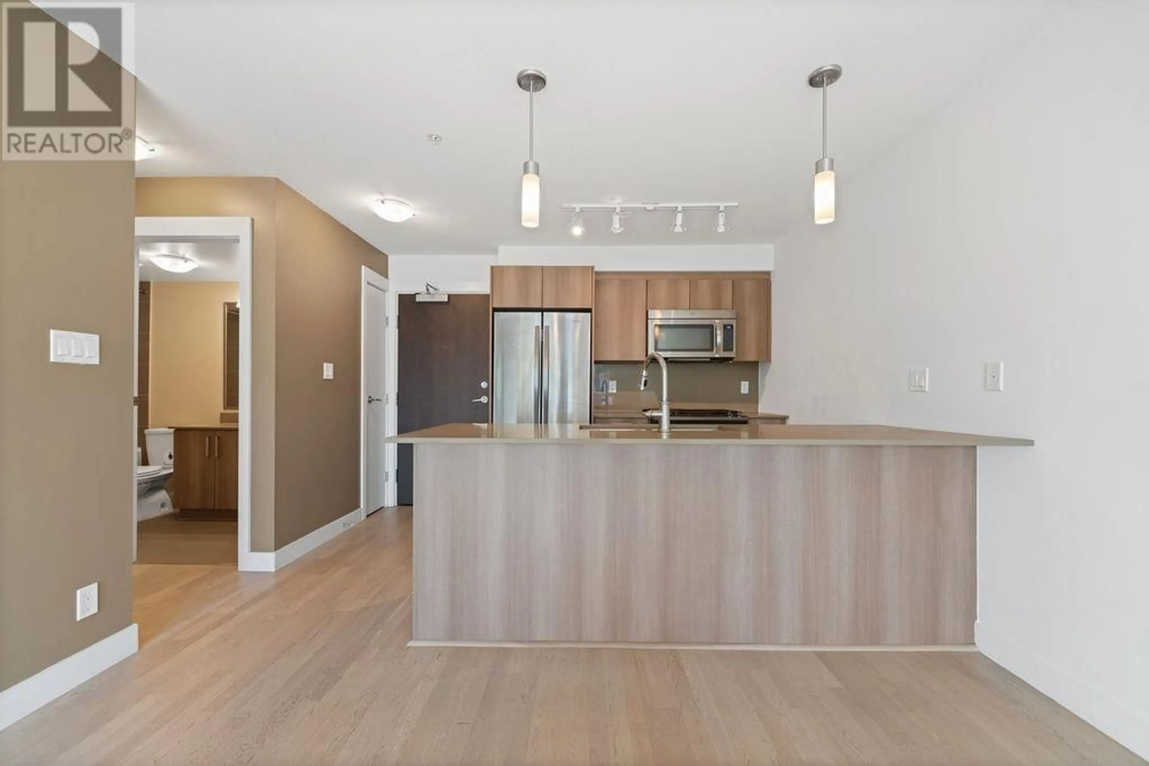 Open concept kitchen, wood/laminate floor for 325 - 7058 14TH AVENUE, Burnaby British Columbia V3N0E6