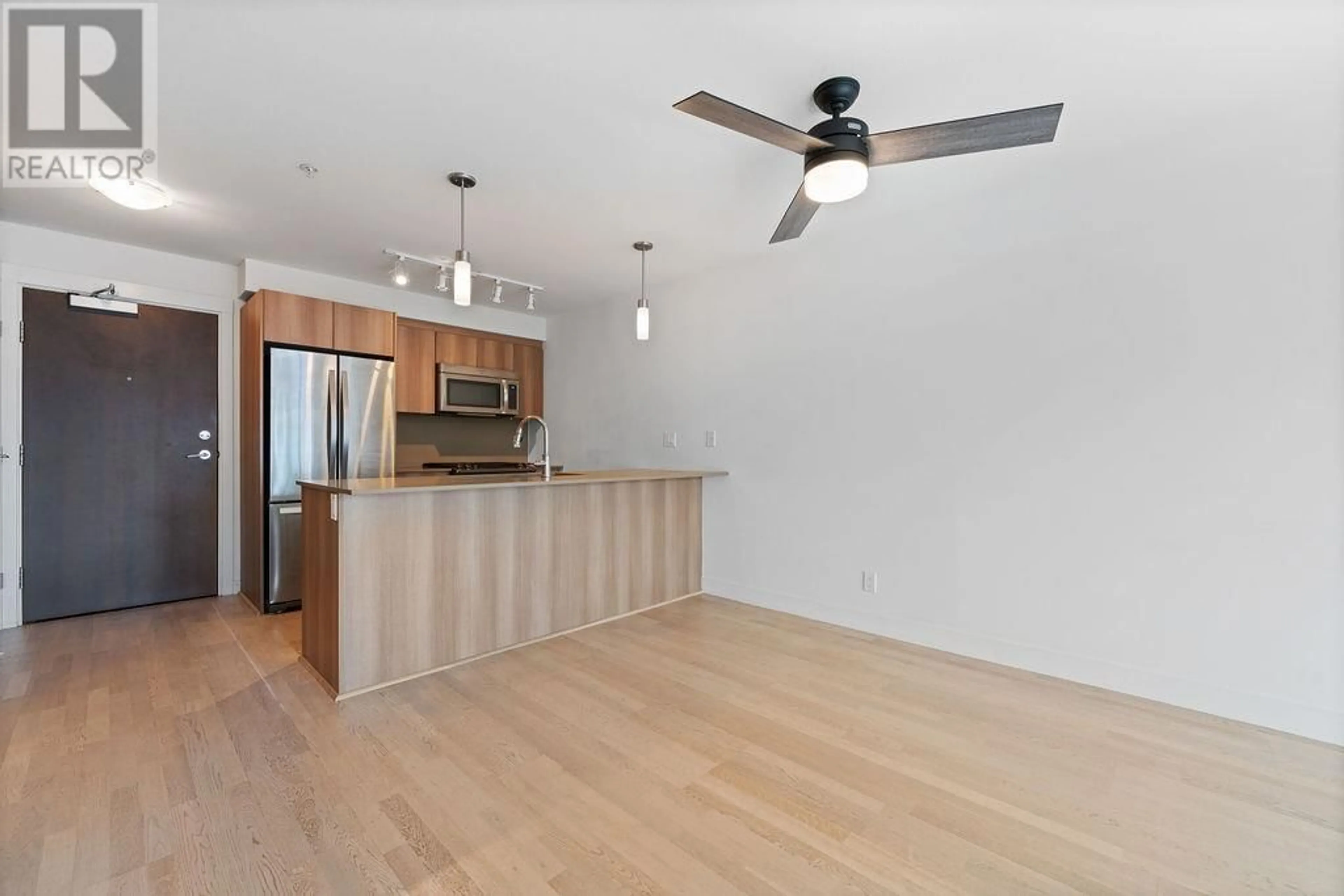 Open concept kitchen, wood/laminate floor for 325 - 7058 14TH AVENUE, Burnaby British Columbia V3N0E6