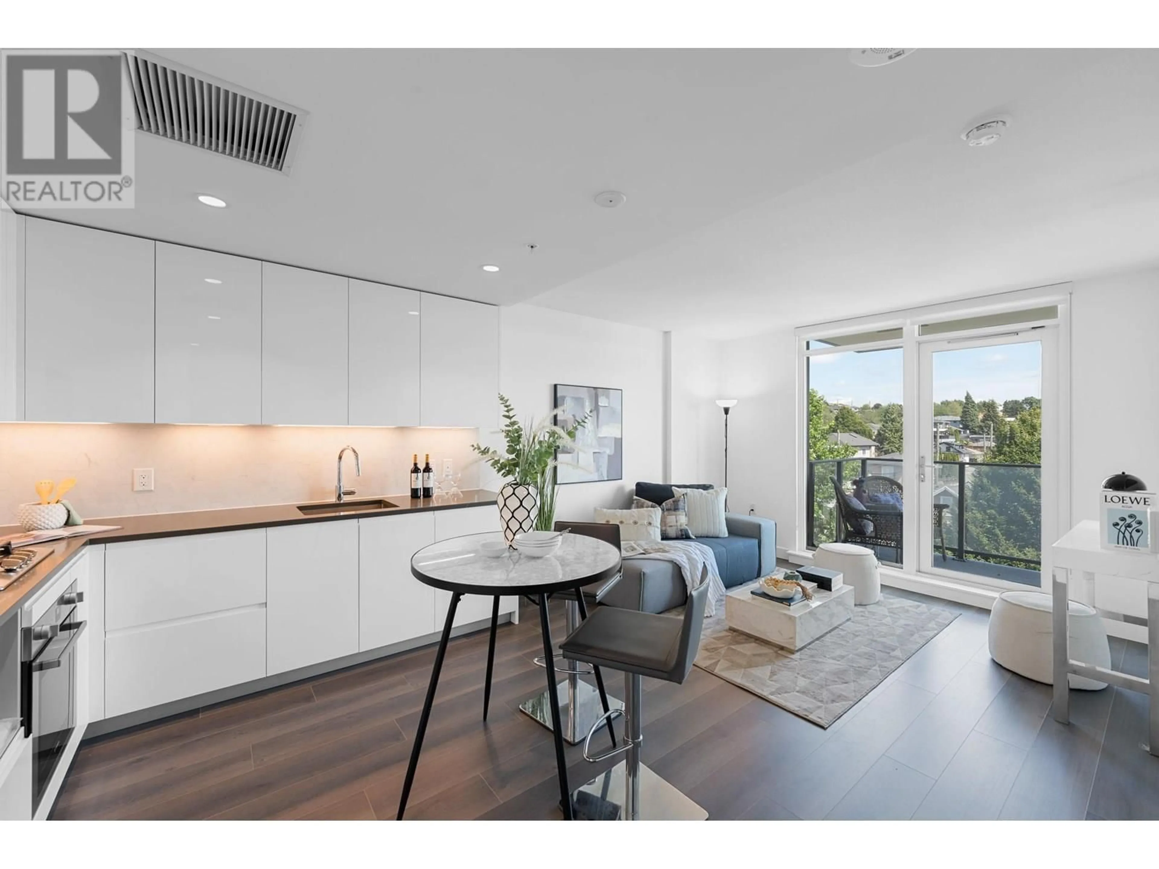 Open concept kitchen, wood/laminate floor for 405 - 8181 CHESTER STREET, Vancouver British Columbia V5X0J9