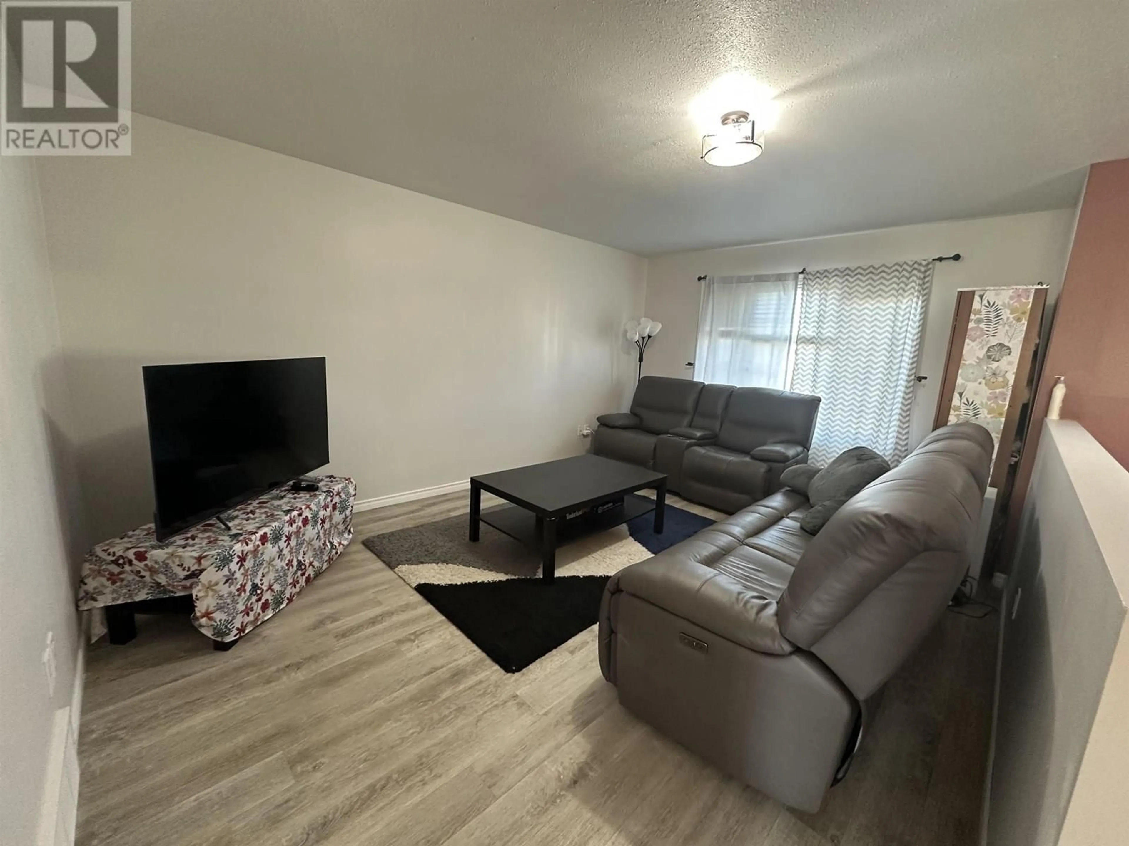 Living room with furniture, unknown for 8413 87 STREET, Fort St. John British Columbia V1J0H4