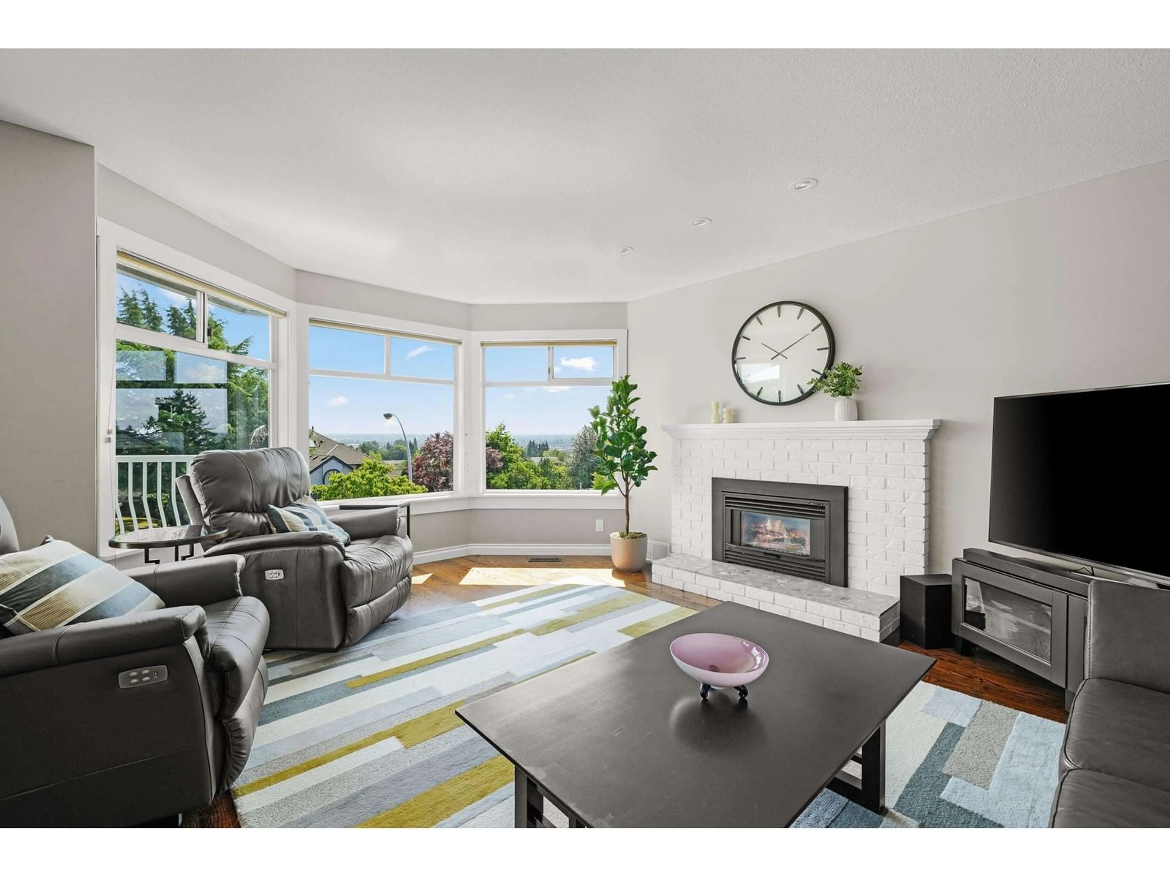 Living room with furniture, wood/laminate floor for 6199 191A, Surrey British Columbia V2S8C7