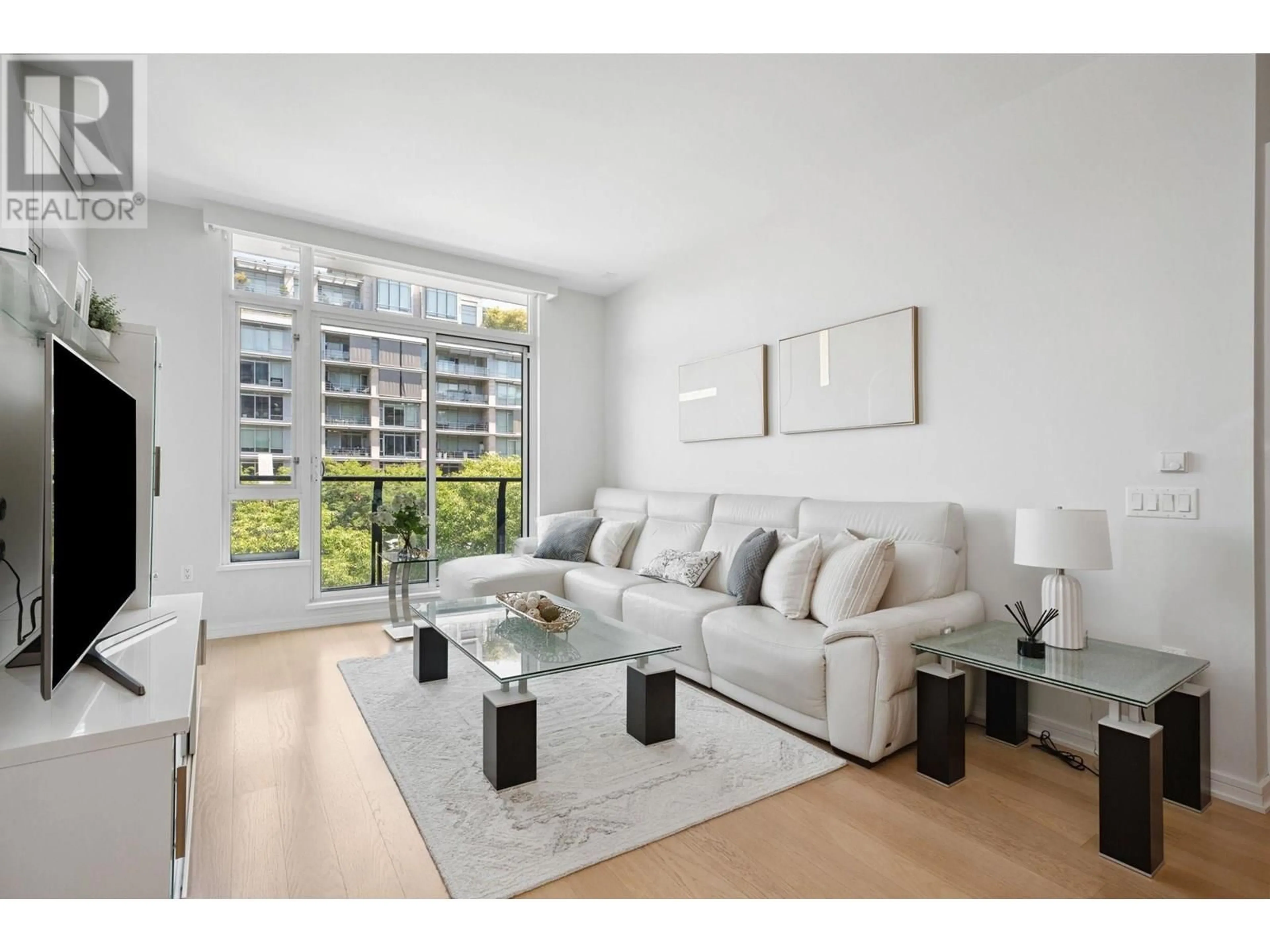 Living room with furniture, wood/laminate floor for 302 - 1625 MANITOBA STREET, Vancouver British Columbia V5Y0B8