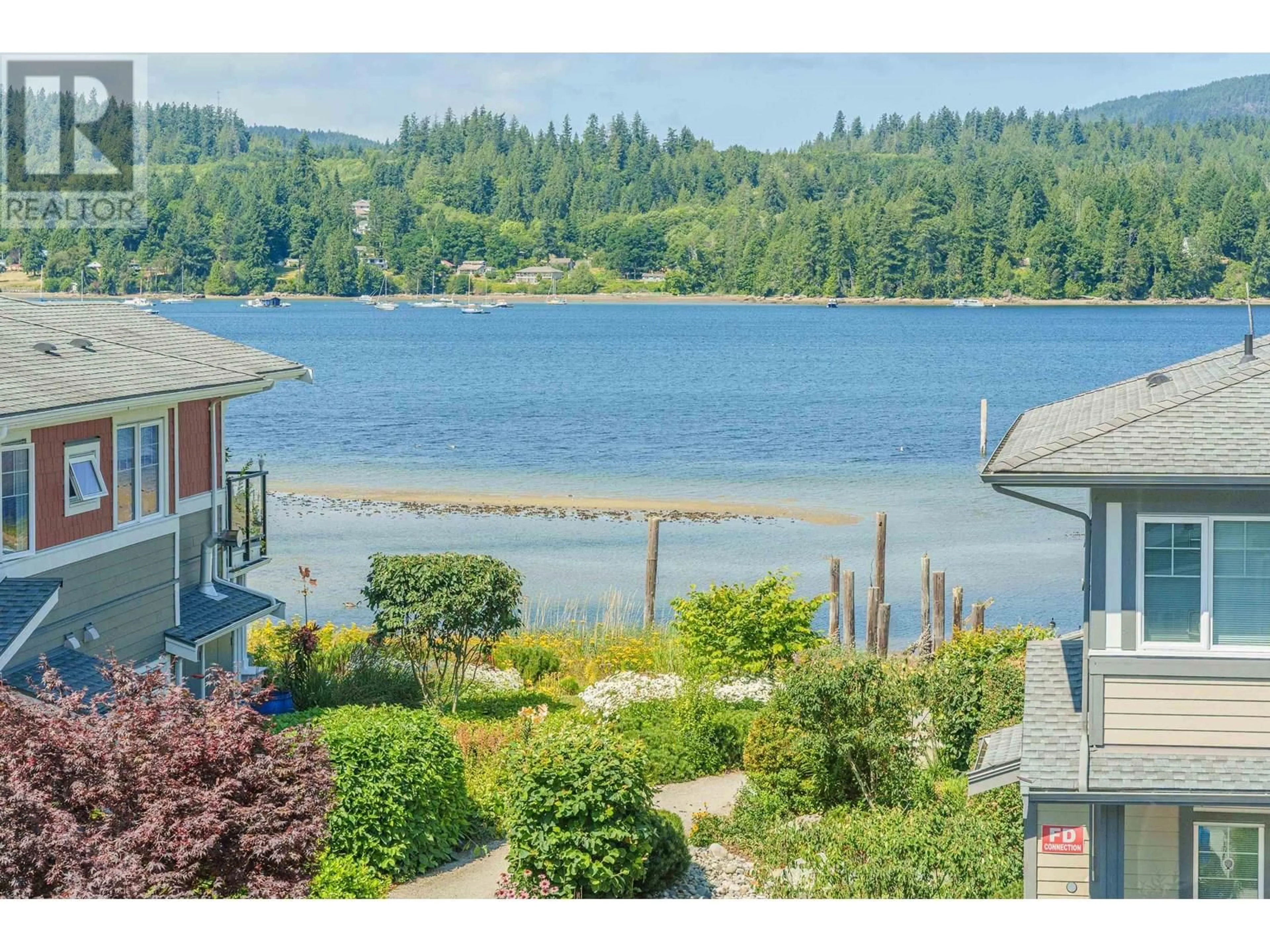 A pic from outside/outdoor area/front of a property/back of a property/a pic from drone, water/lake/river/ocean view for 5954 BEACHGATE LANE, Sechelt British Columbia V7Z0S2
