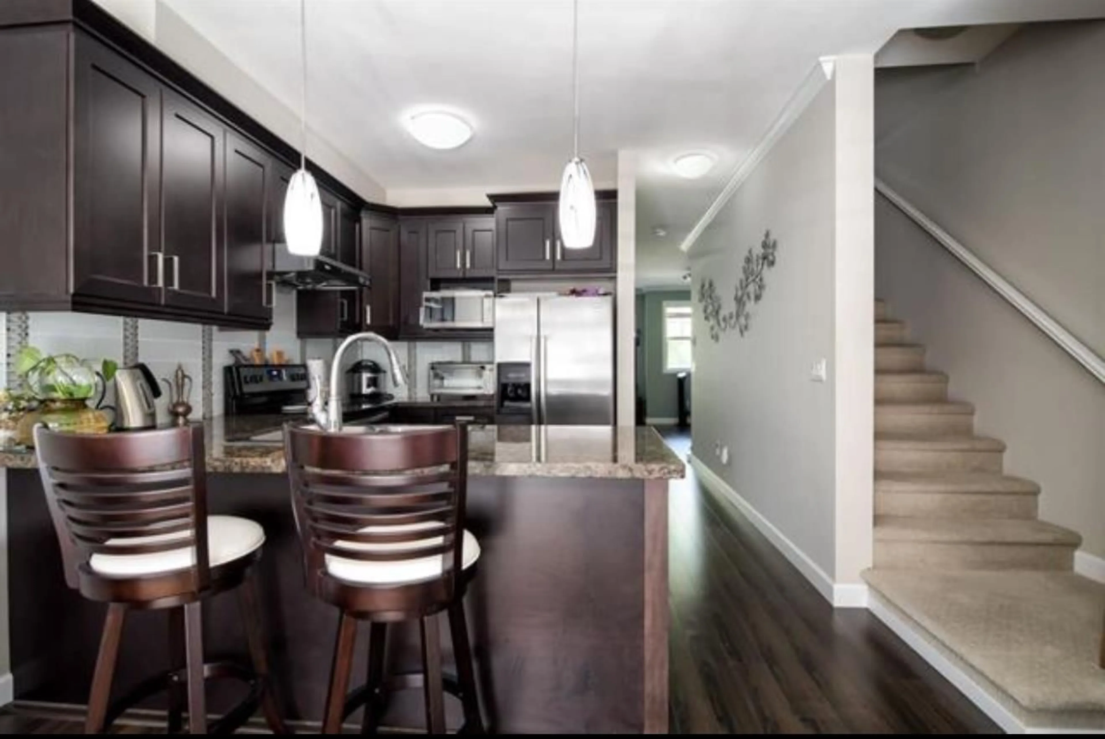 Open concept kitchen, wood/laminate floor for 23 - 7121 192, Surrey British Columbia V4N6K6