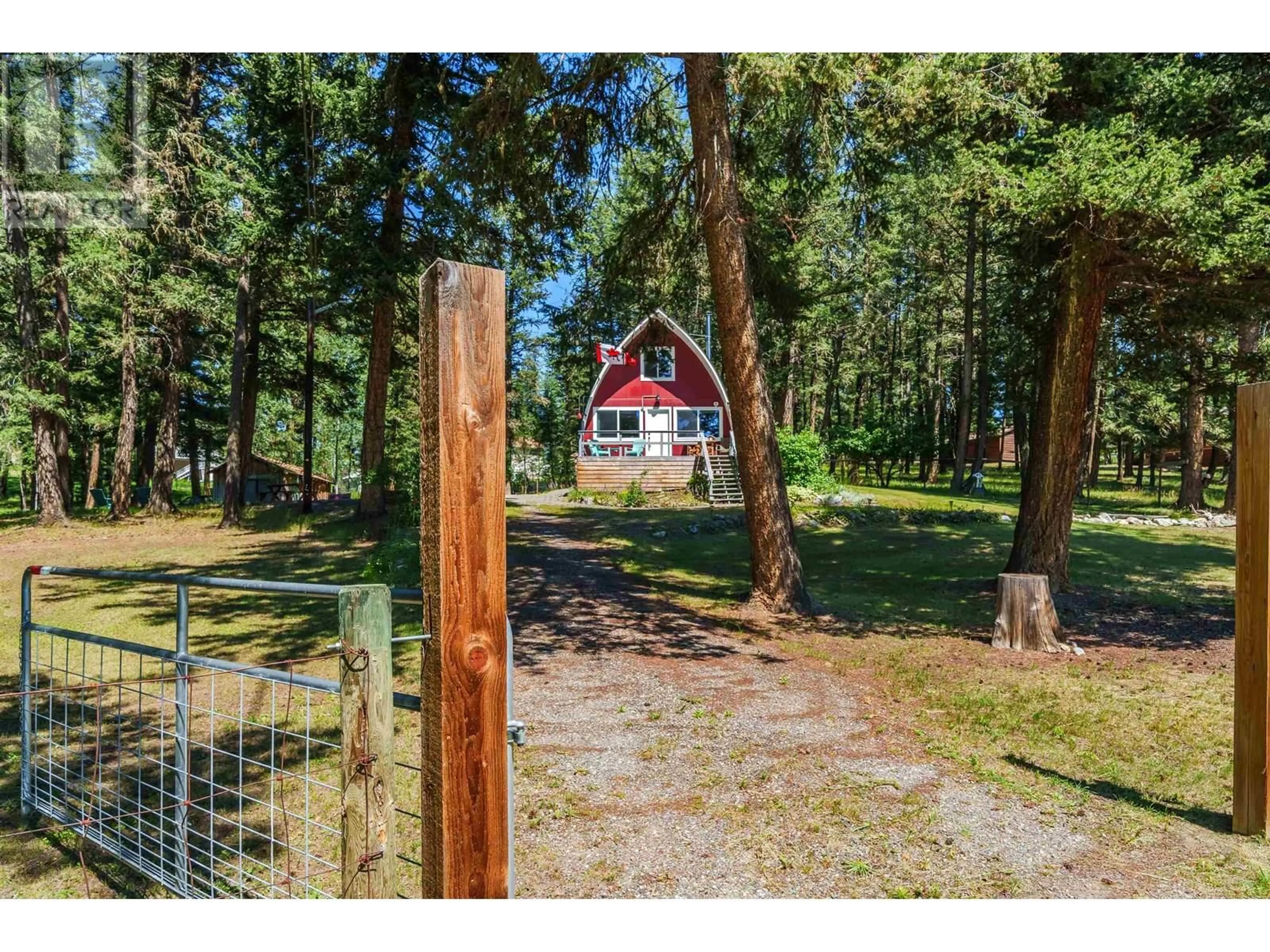 A pic from outside/outdoor area/front of a property/back of a property/a pic from drone, forest/trees view for 5176 KALLUM DRIVE, 108 Mile Ranch British Columbia V0K2Z0