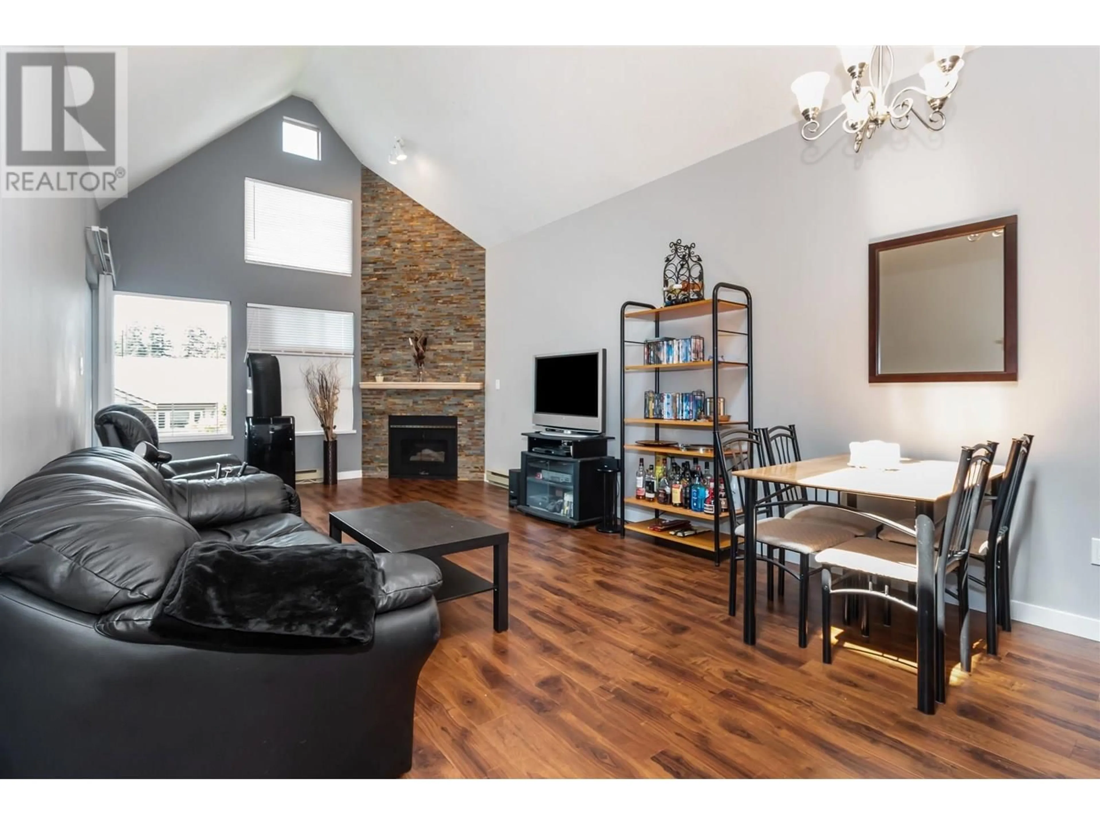 Living room with furniture, wood/laminate floor for 307 - 7465 SANDBORNE AVENUE, Burnaby British Columbia V3N4W7