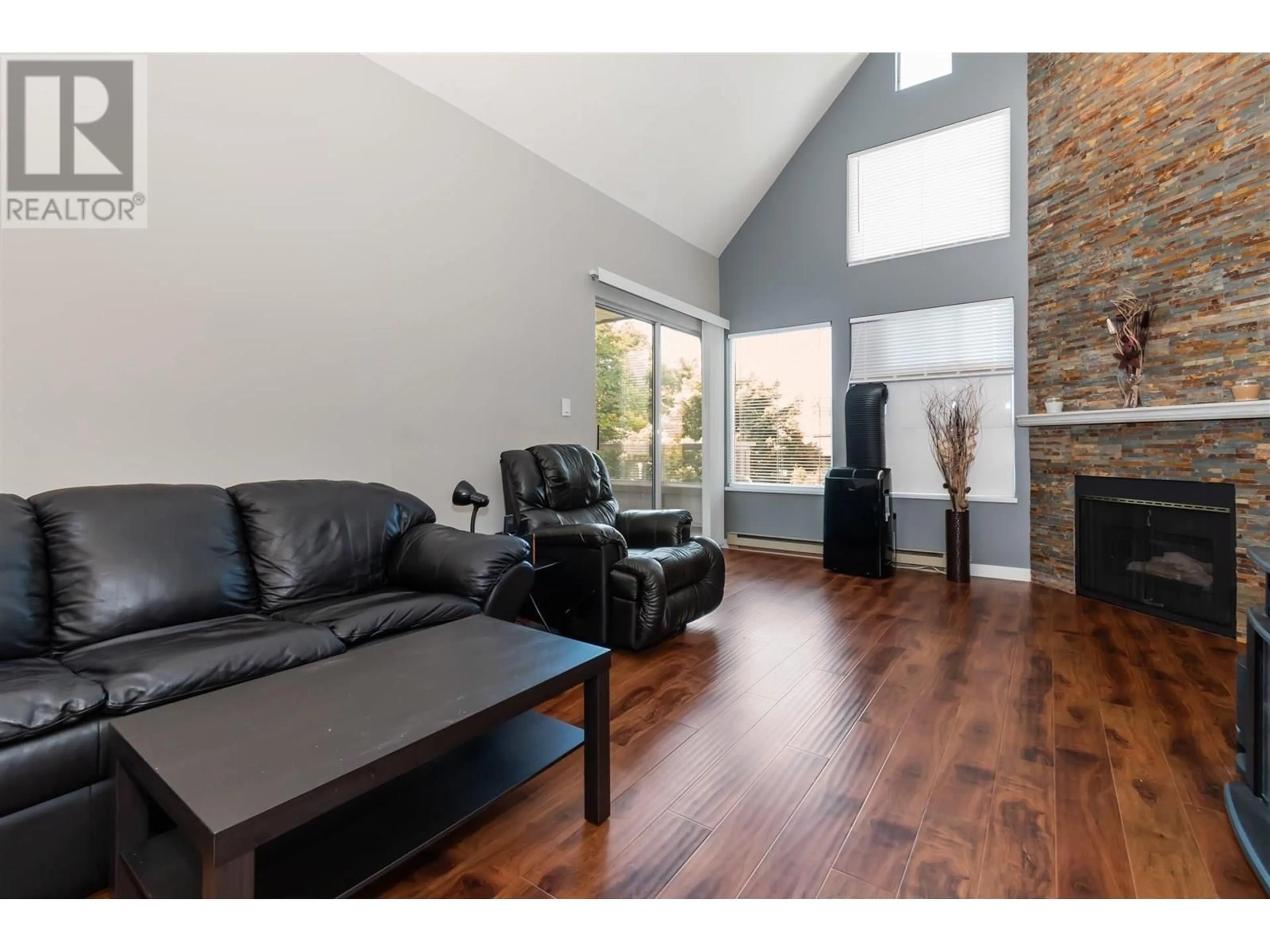 Living room with furniture, wood/laminate floor for 307 - 7465 SANDBORNE AVENUE, Burnaby British Columbia V3N4W7