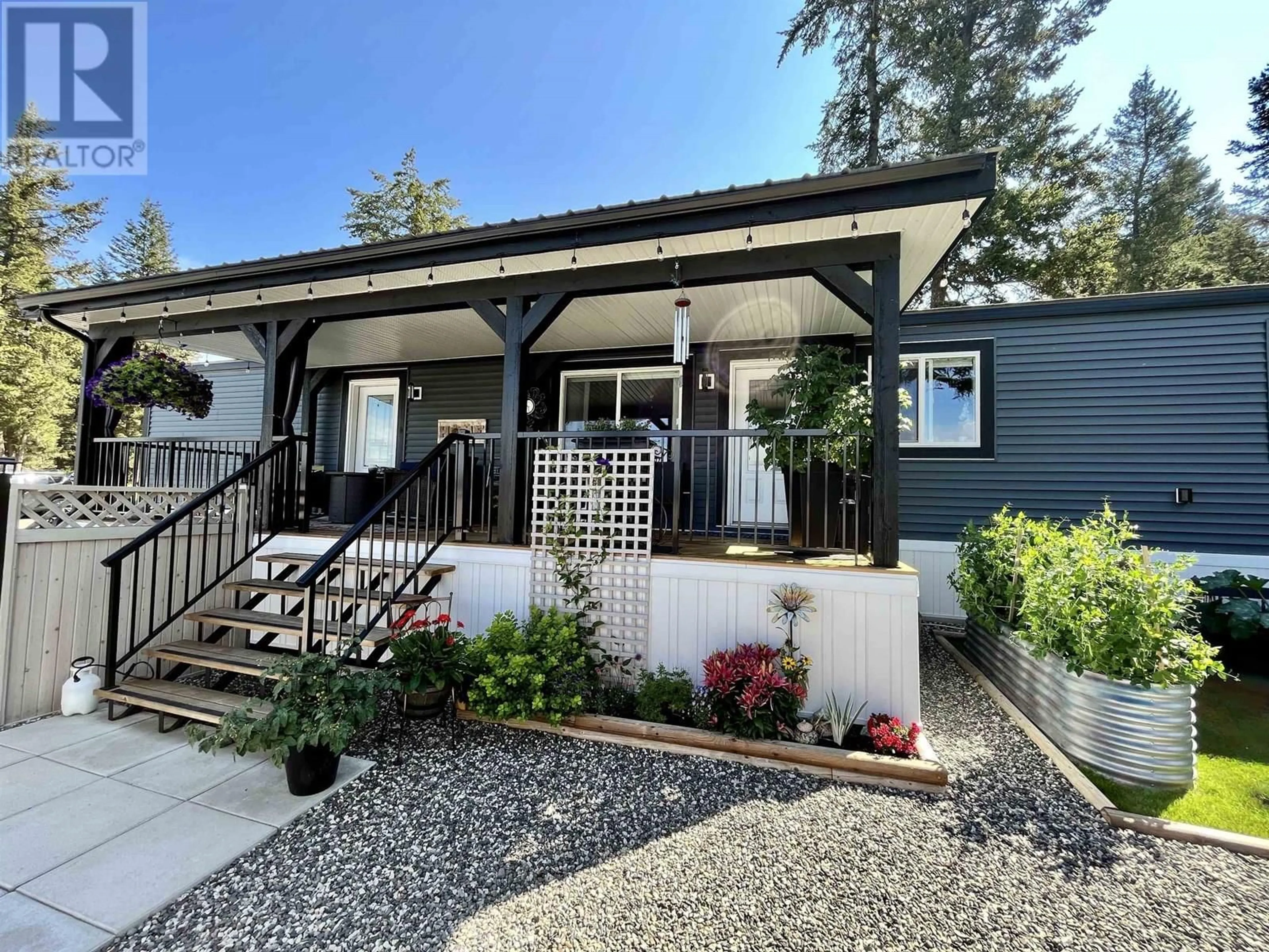Home with vinyl exterior material, street for 16 - 4072 STATION ROAD, Lac La Hache British Columbia V0K1T0