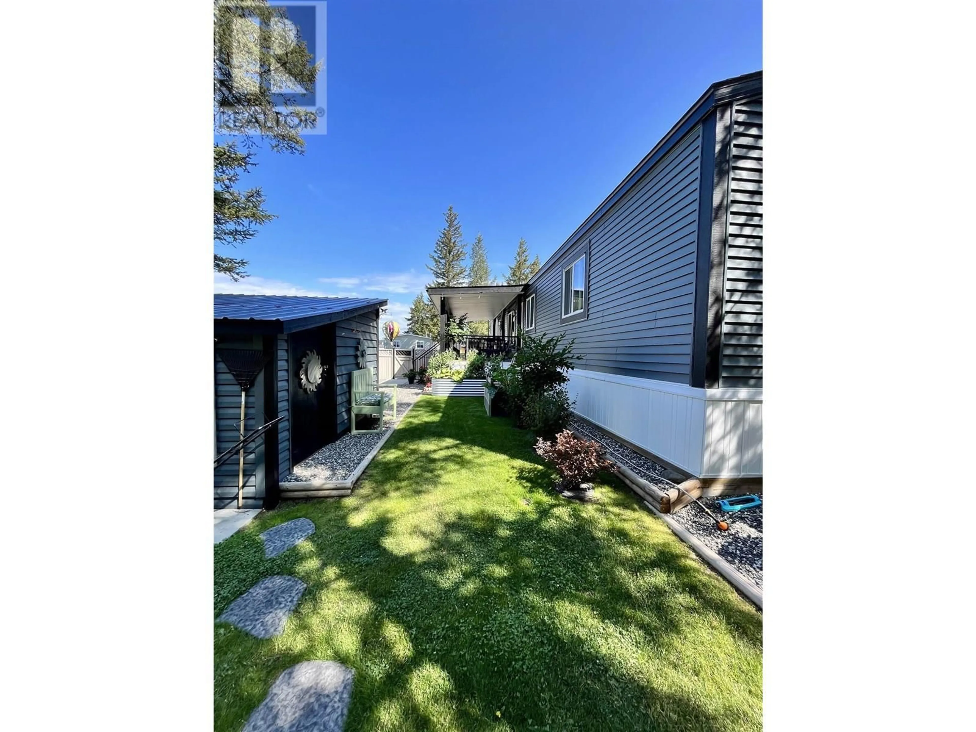 A pic from outside/outdoor area/front of a property/back of a property/a pic from drone, street for 16 - 4072 STATION ROAD, Lac La Hache British Columbia V0K1T0
