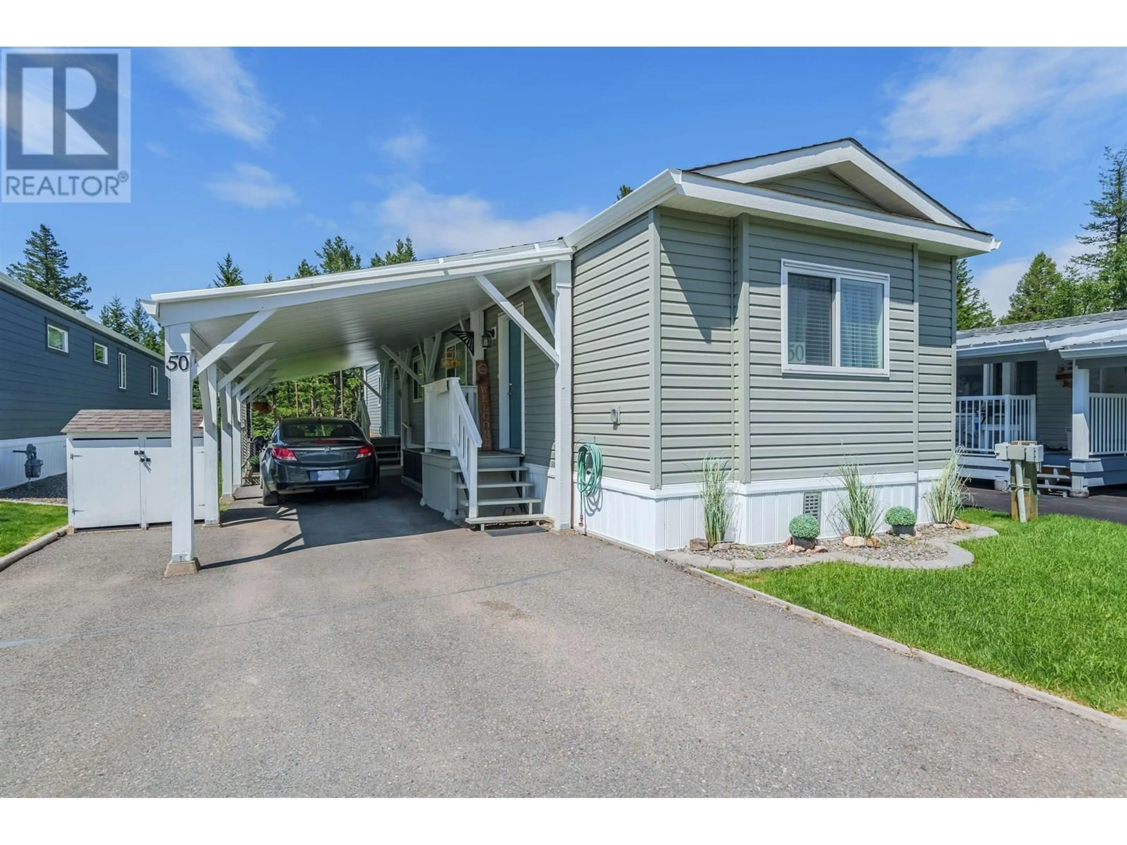 Home with vinyl exterior material, street for 50 - 208 8TH STREET, 100 Mile House British Columbia V0K2E0