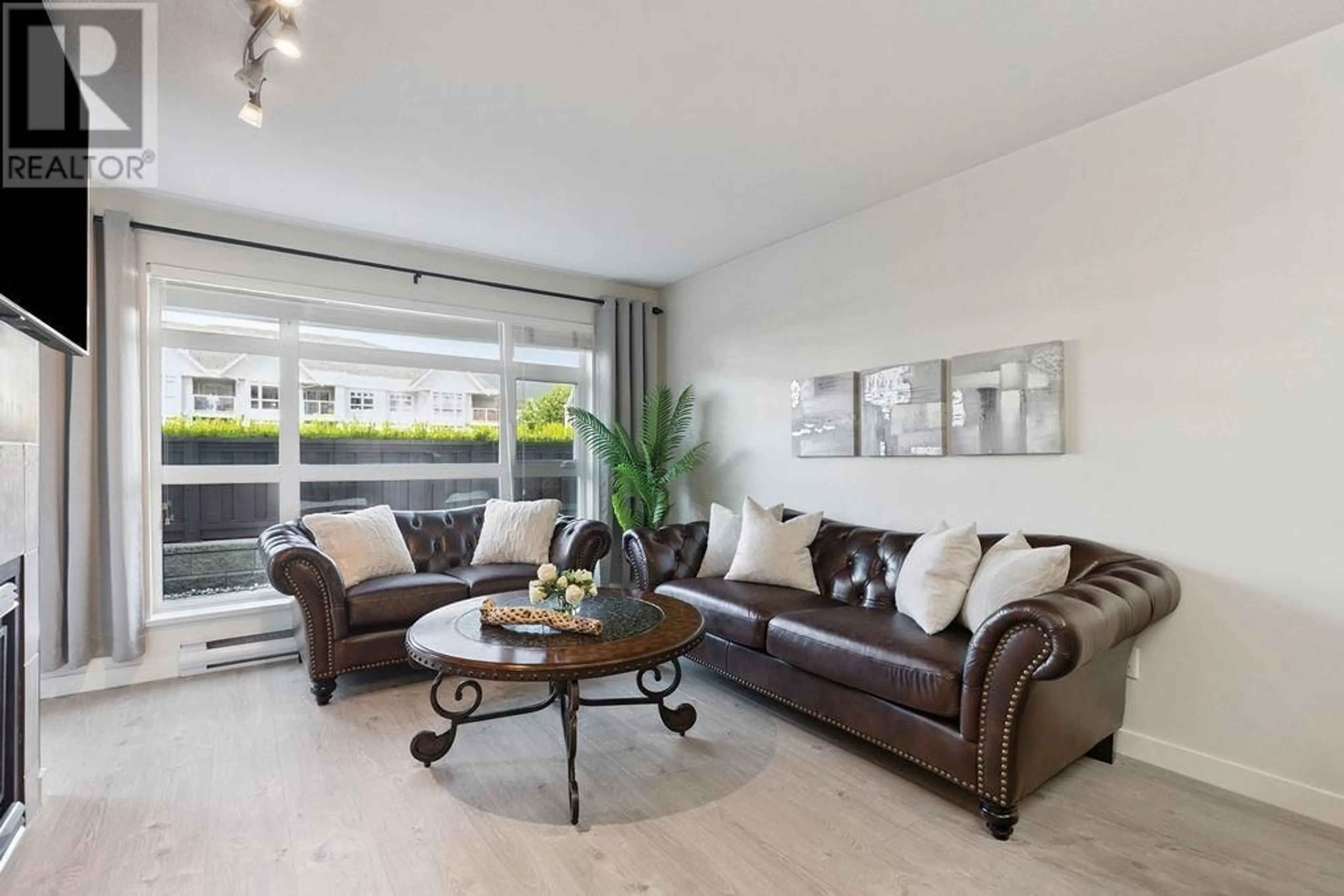Living room with furniture, wood/laminate floor for 109 - 3122 ST JOHNS STREET, Port Moody British Columbia V3H5C8