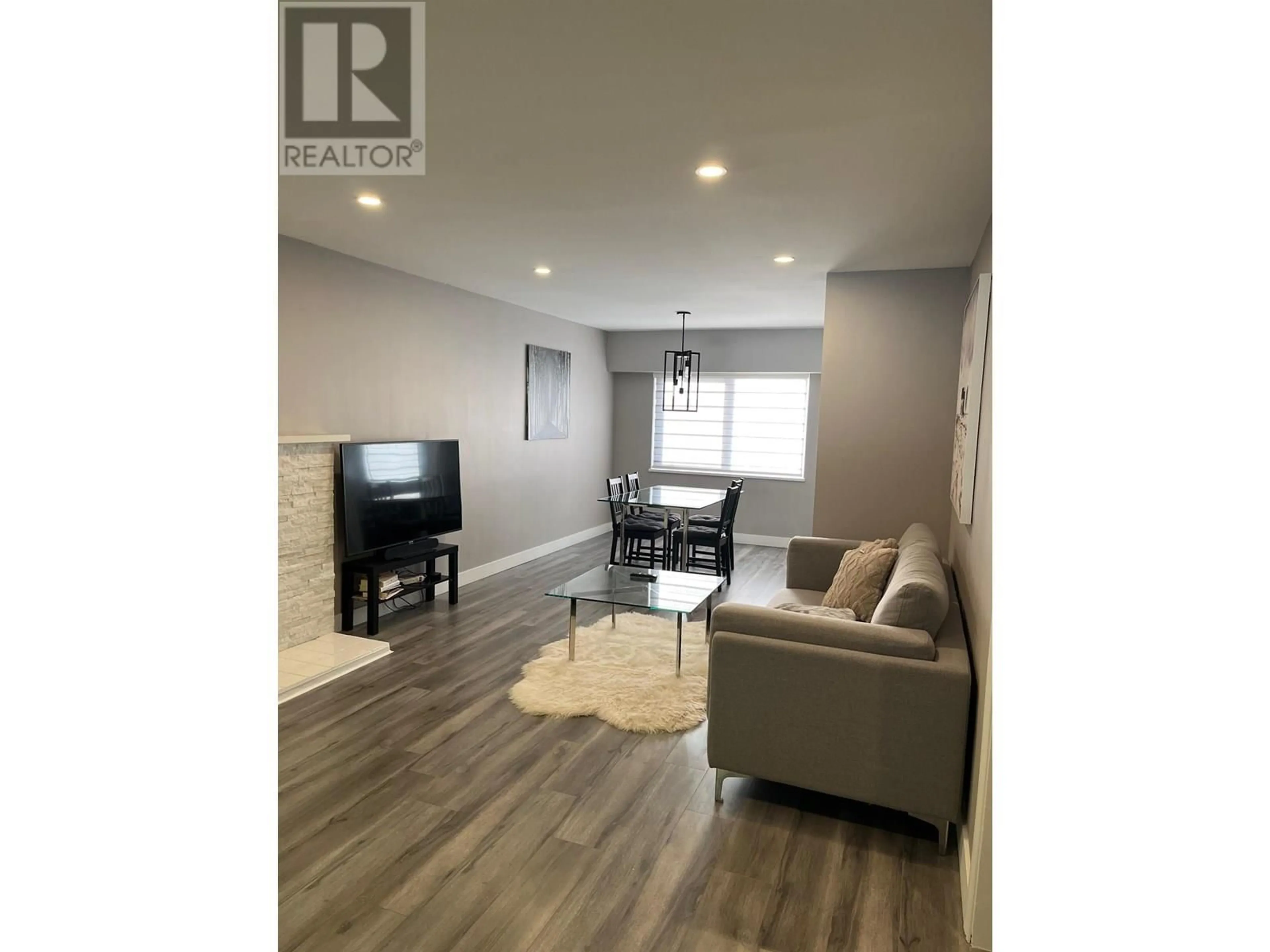 Living room with furniture, wood/laminate floor for 4749 FAIRMONT STREET, Vancouver British Columbia V5R3V1
