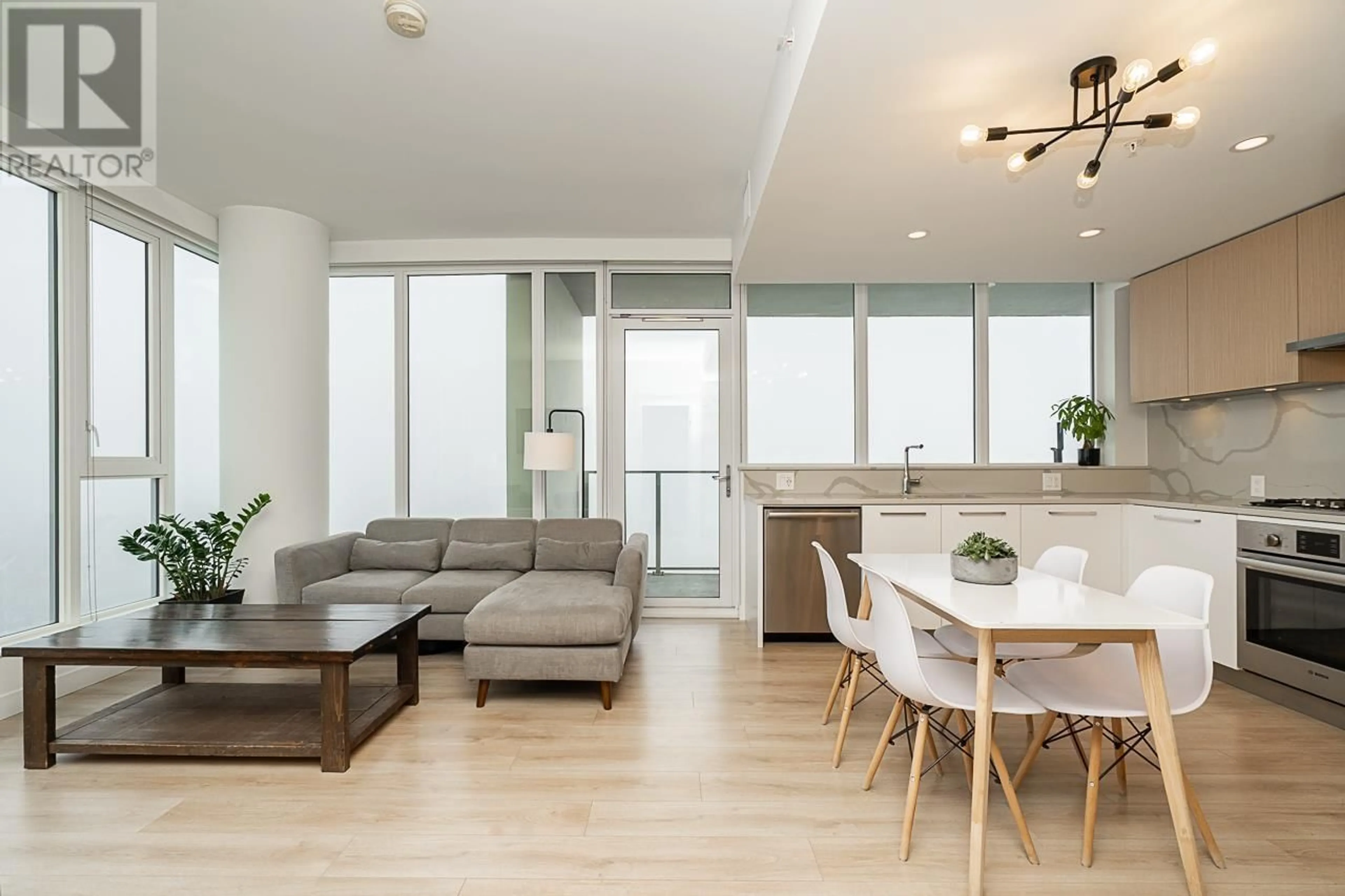 Living room with furniture, wood/laminate floor for 2704 - 567 CLARKE ROAD, Coquitlam British Columbia V3J0K7