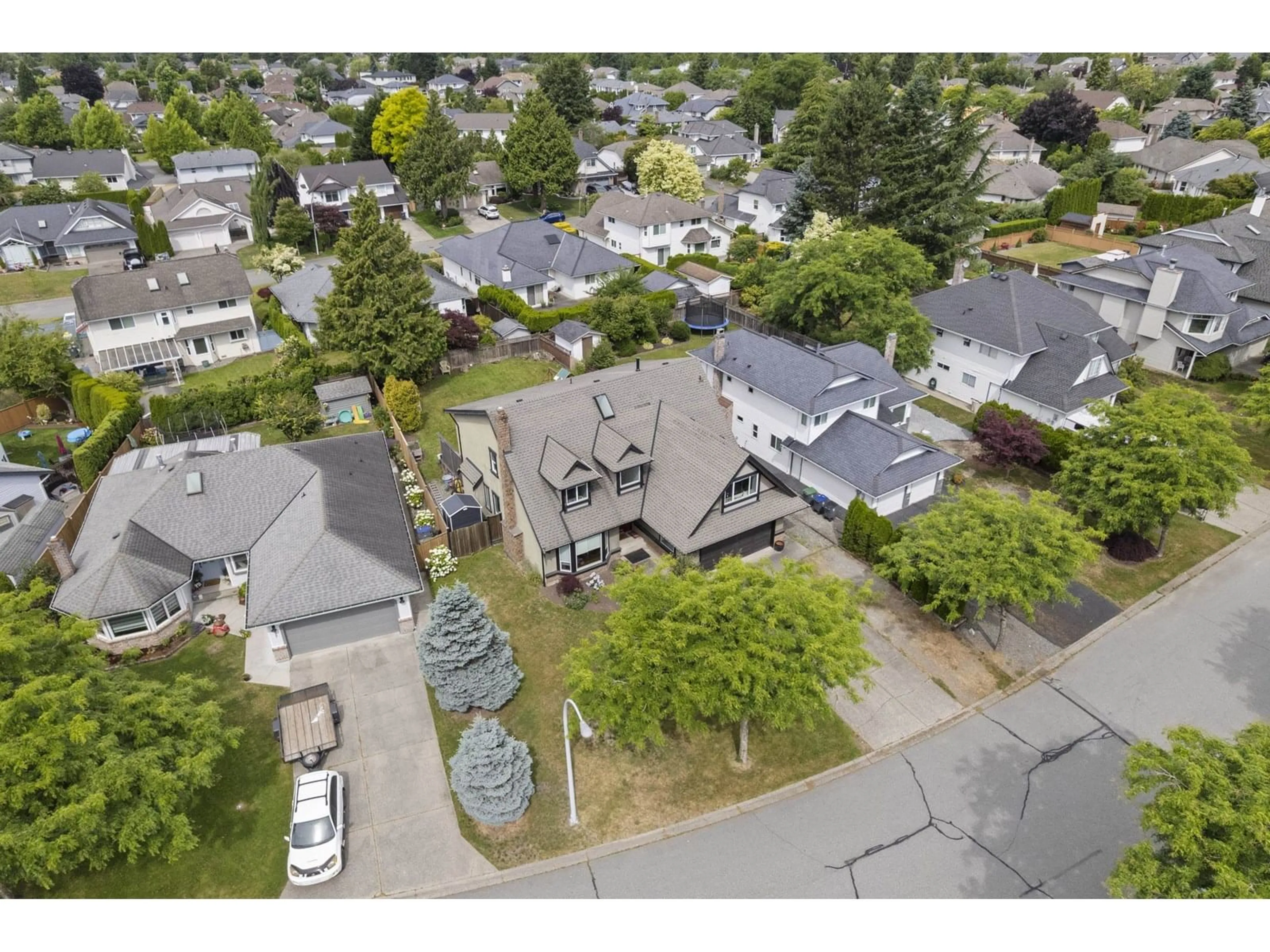 A pic from outside/outdoor area/front of a property/back of a property/a pic from drone, street for 6105 187A, Surrey British Columbia V3S7R6