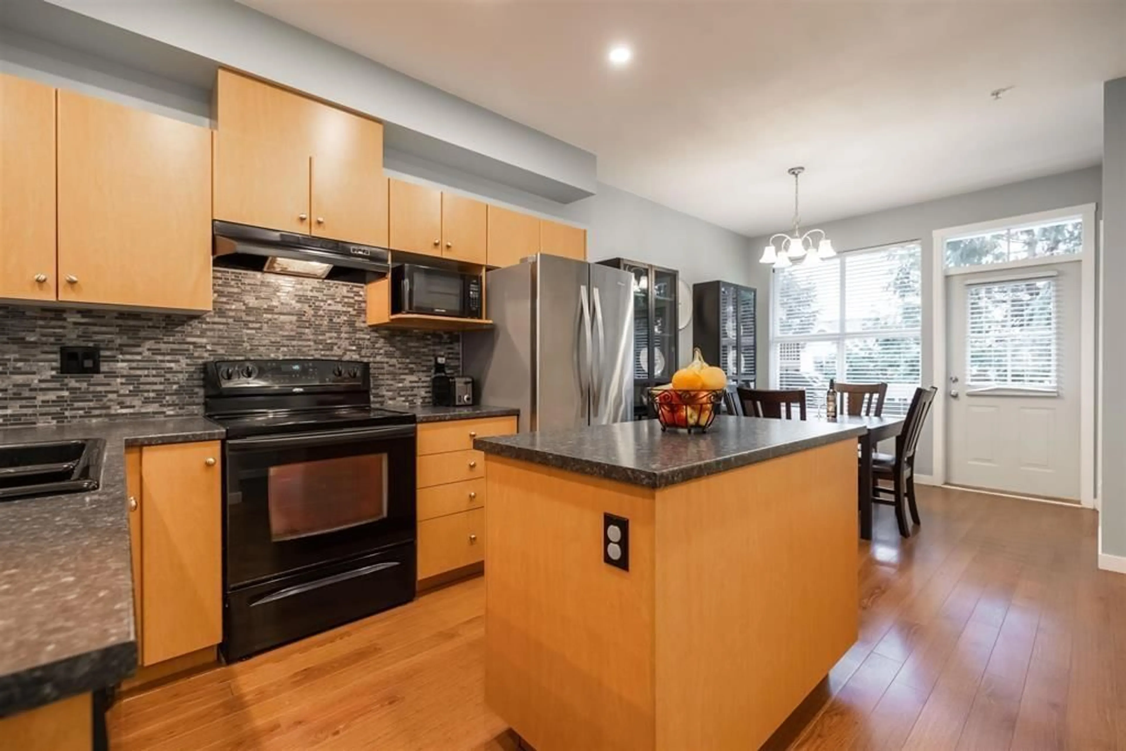 Open concept kitchen, wood/laminate floor for 37 - 20460 66, Langley British Columbia V2Y3B6