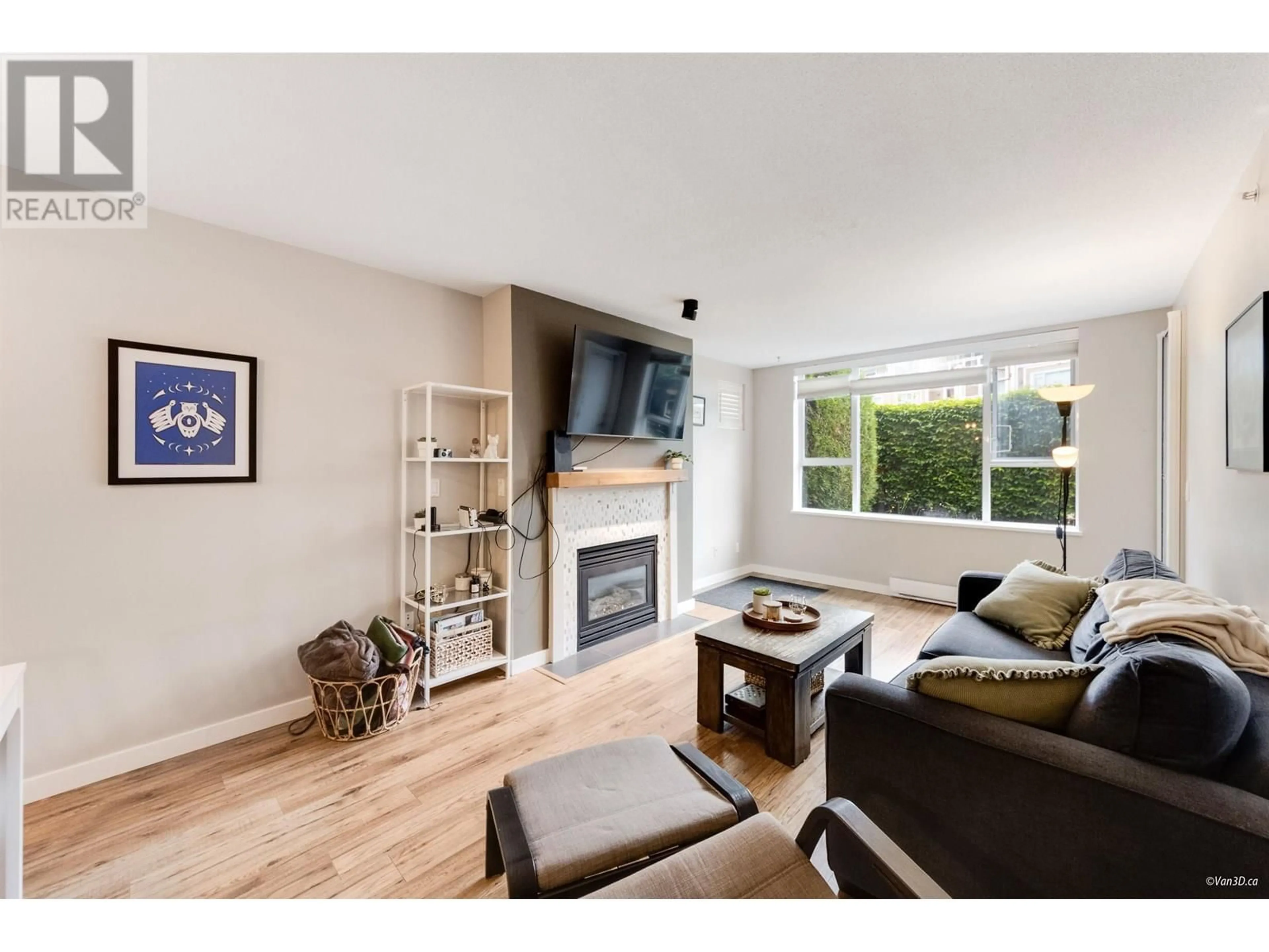 Living room with furniture, wood/laminate floor for 103 - 3608 DEERCREST DRIVE, North Vancouver British Columbia V7G2S8