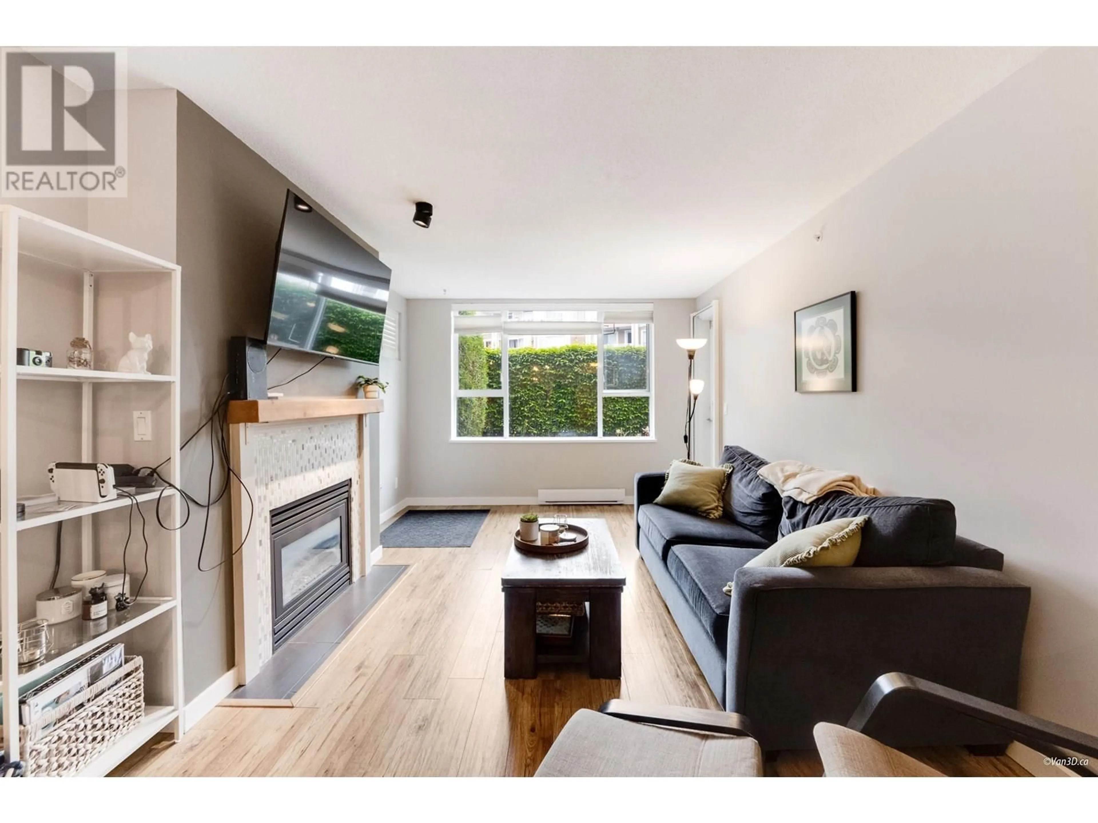Living room with furniture, wood/laminate floor for 103 - 3608 DEERCREST DRIVE, North Vancouver British Columbia V7G2S8