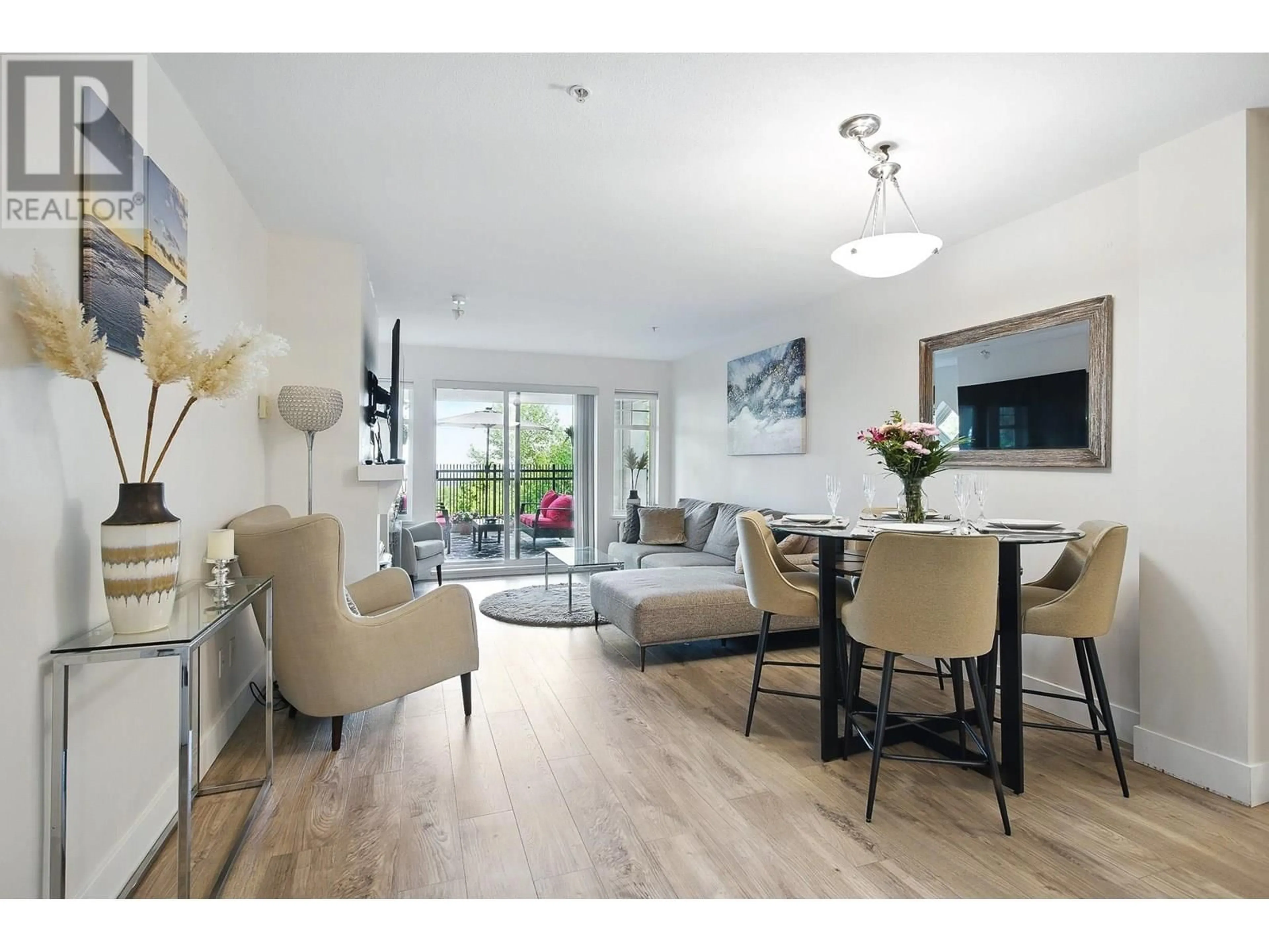 Living room with furniture, wood/laminate floor for 102 - 1438 PARKWAY BOULEVARD, Coquitlam British Columbia V3E3M1