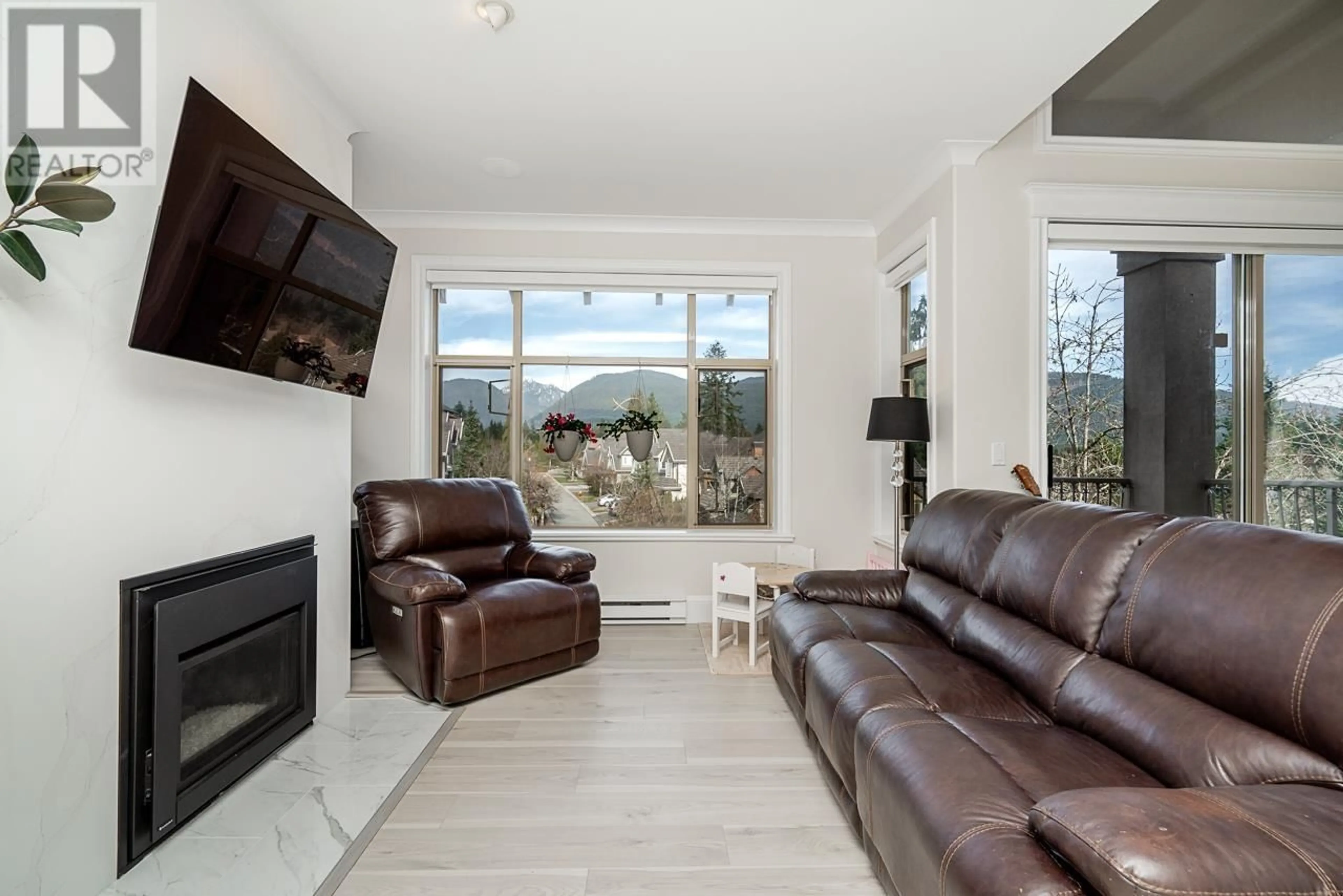 Living room with furniture, unknown for 408 - 3176 PLATEAU BOULEVARD, Coquitlam British Columbia V3E3J2