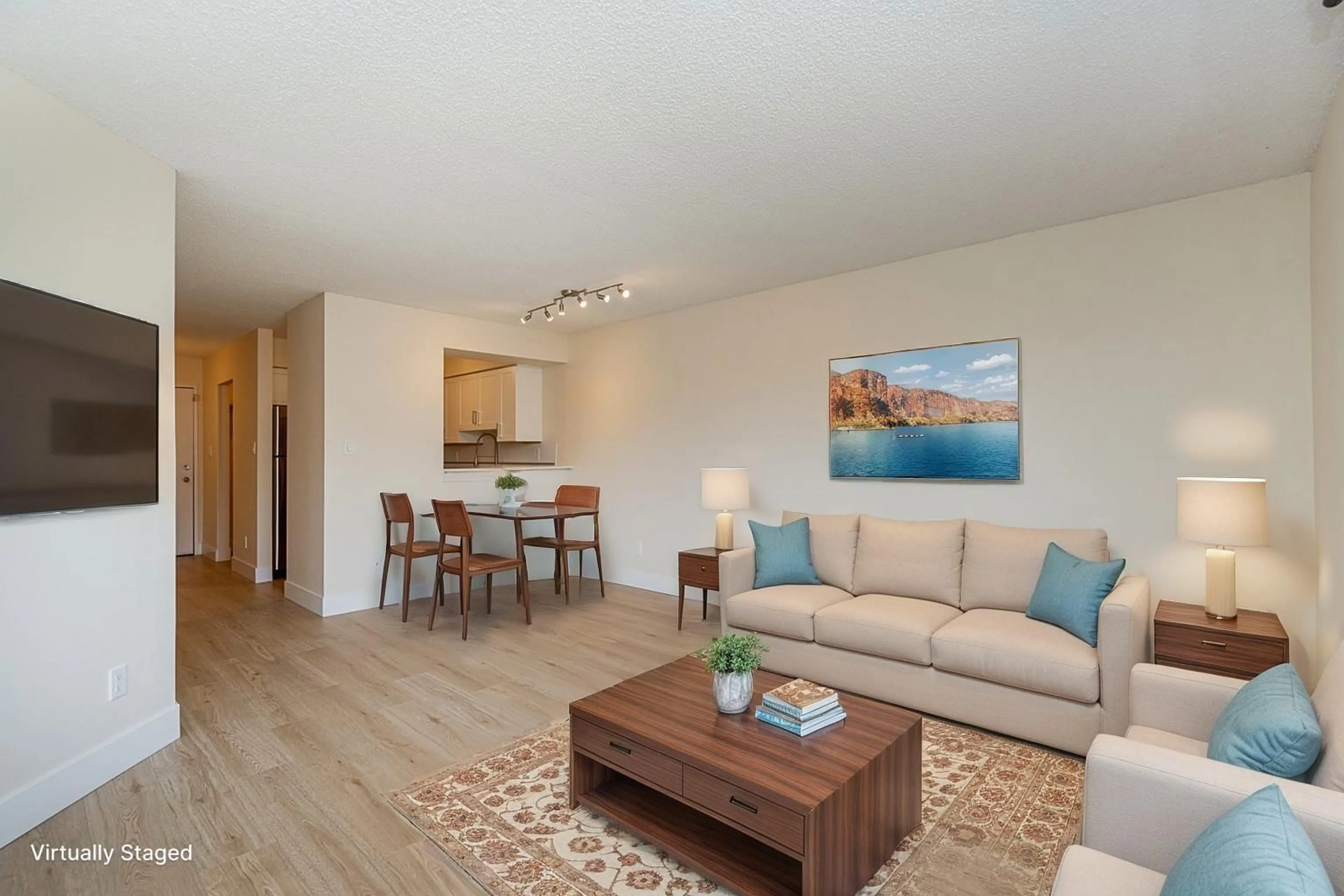 Living room with furniture, wood/laminate floor for 204 - 5294 204, Langley British Columbia V3A1Z1