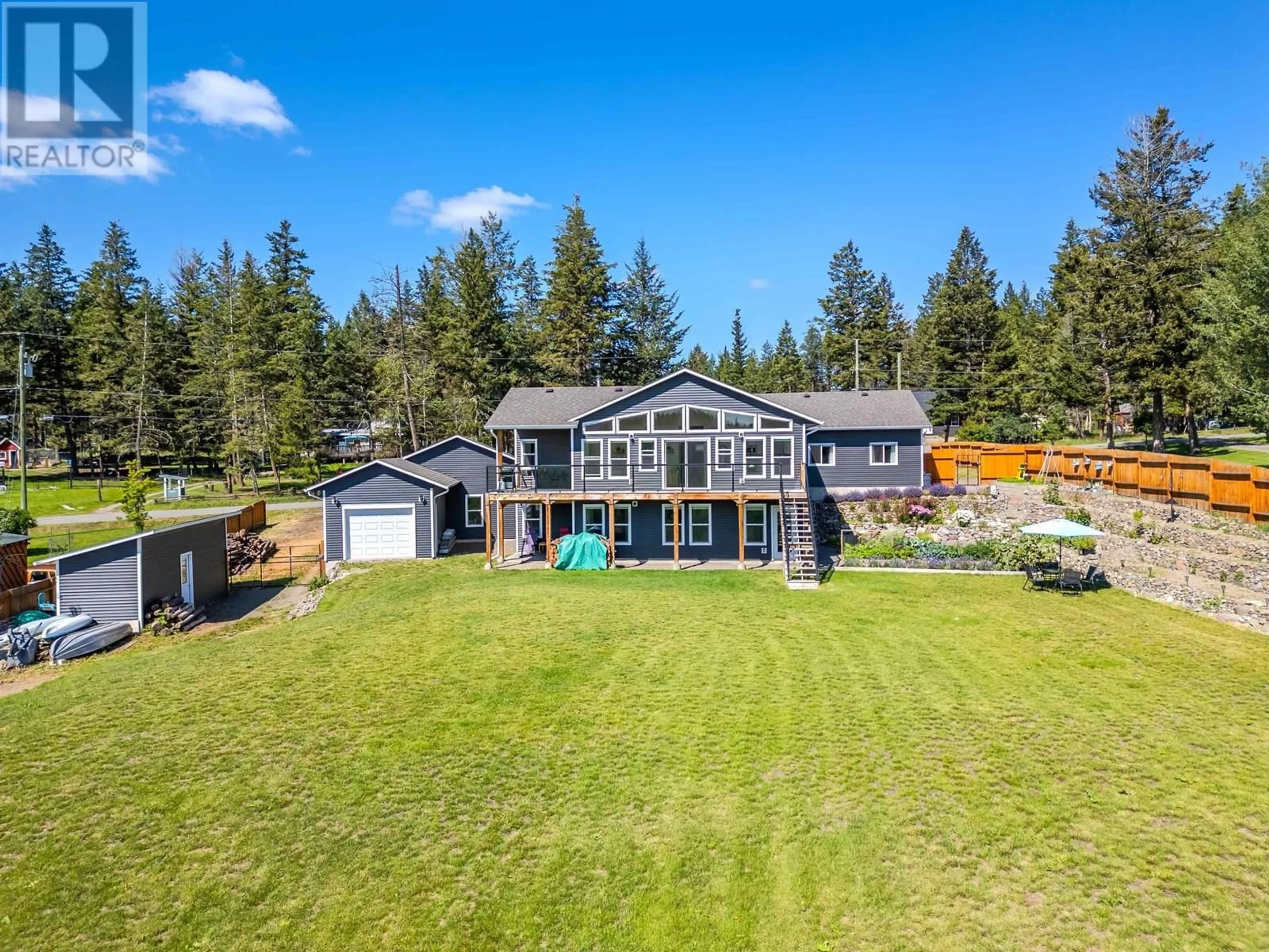 A pic from outside/outdoor area/front of a property/back of a property/a pic from drone, water/lake/river/ocean view for 5066 BLOCK DRIVE, 108 Mile Ranch British Columbia V0K2E0