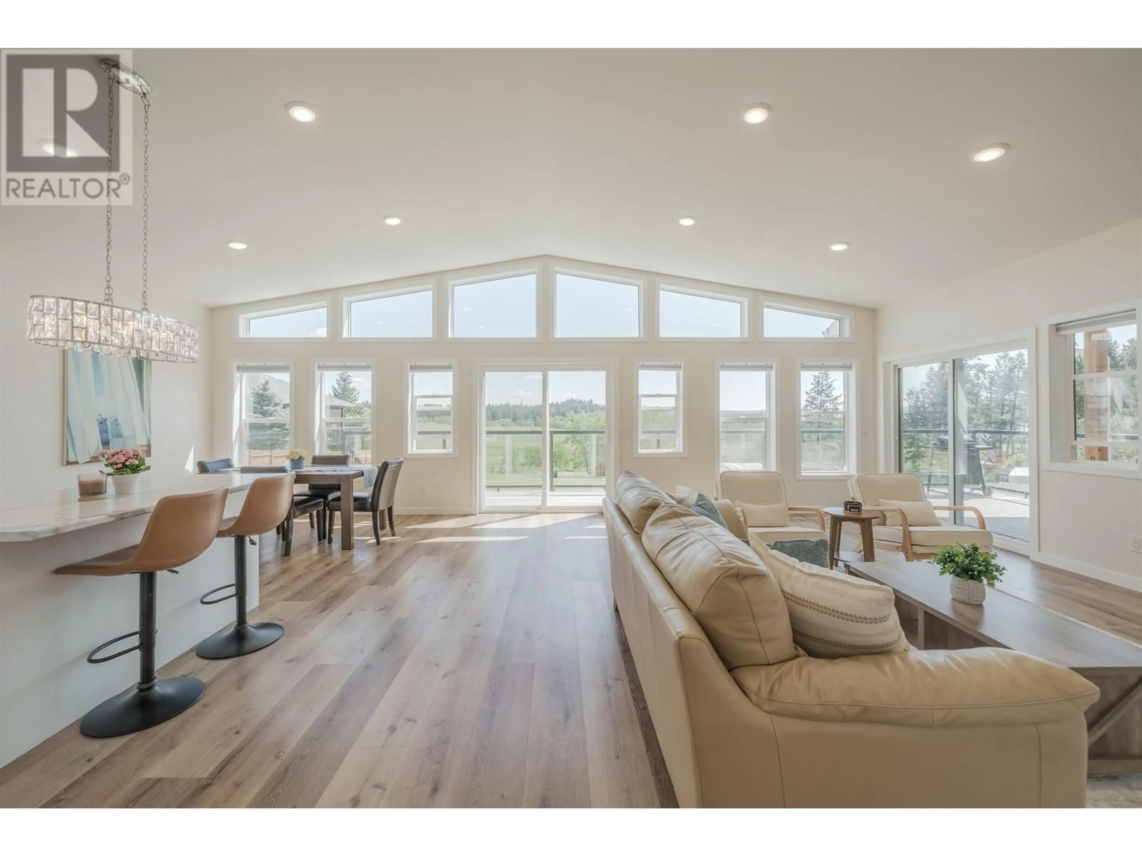 Living room with furniture, wood/laminate floor for 5066 BLOCK DRIVE, 108 Mile Ranch British Columbia V0K2E0