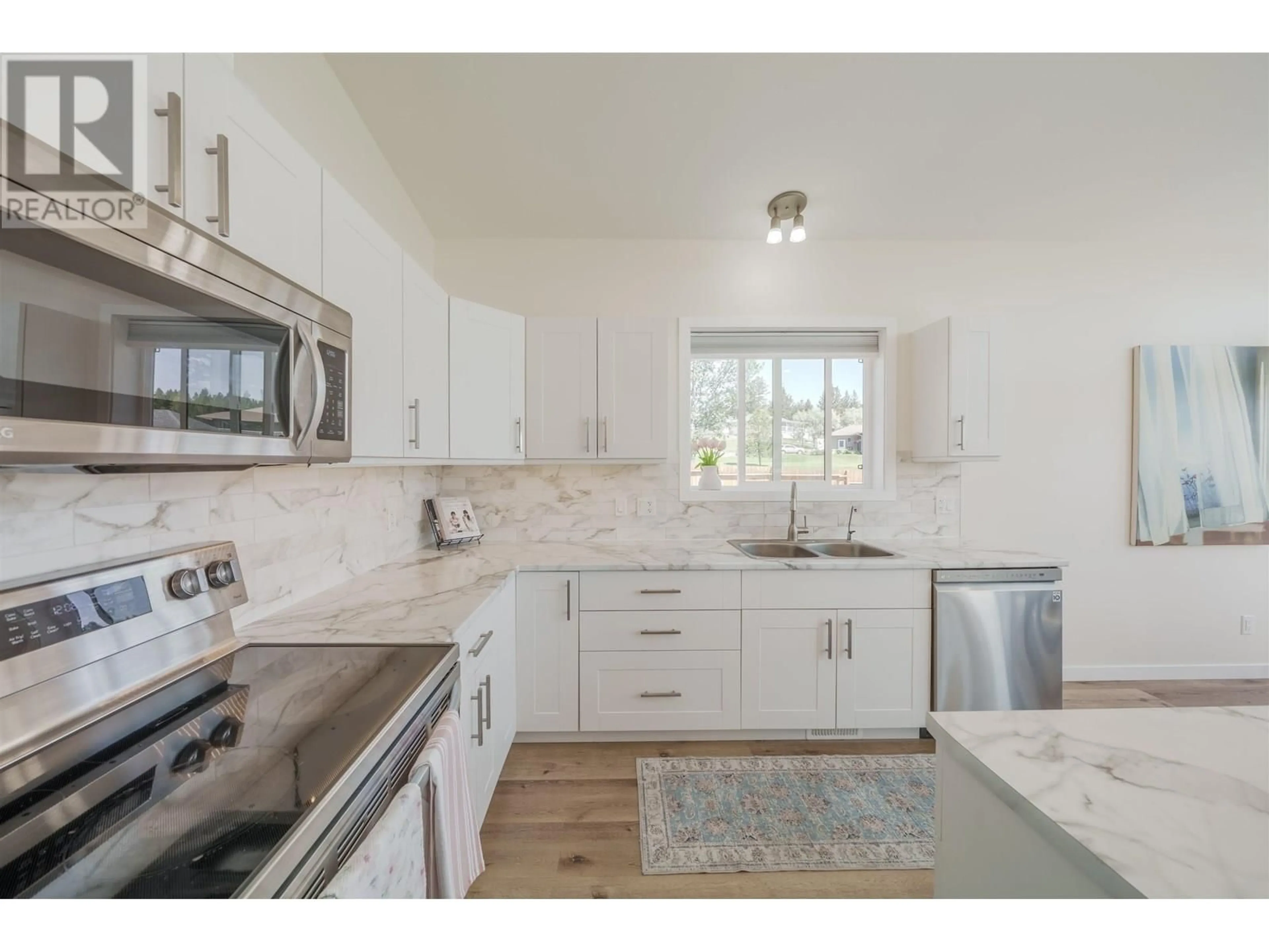 Open concept kitchen, ceramic/tile floor for 5066 BLOCK DRIVE, 108 Mile Ranch British Columbia V0K2E0