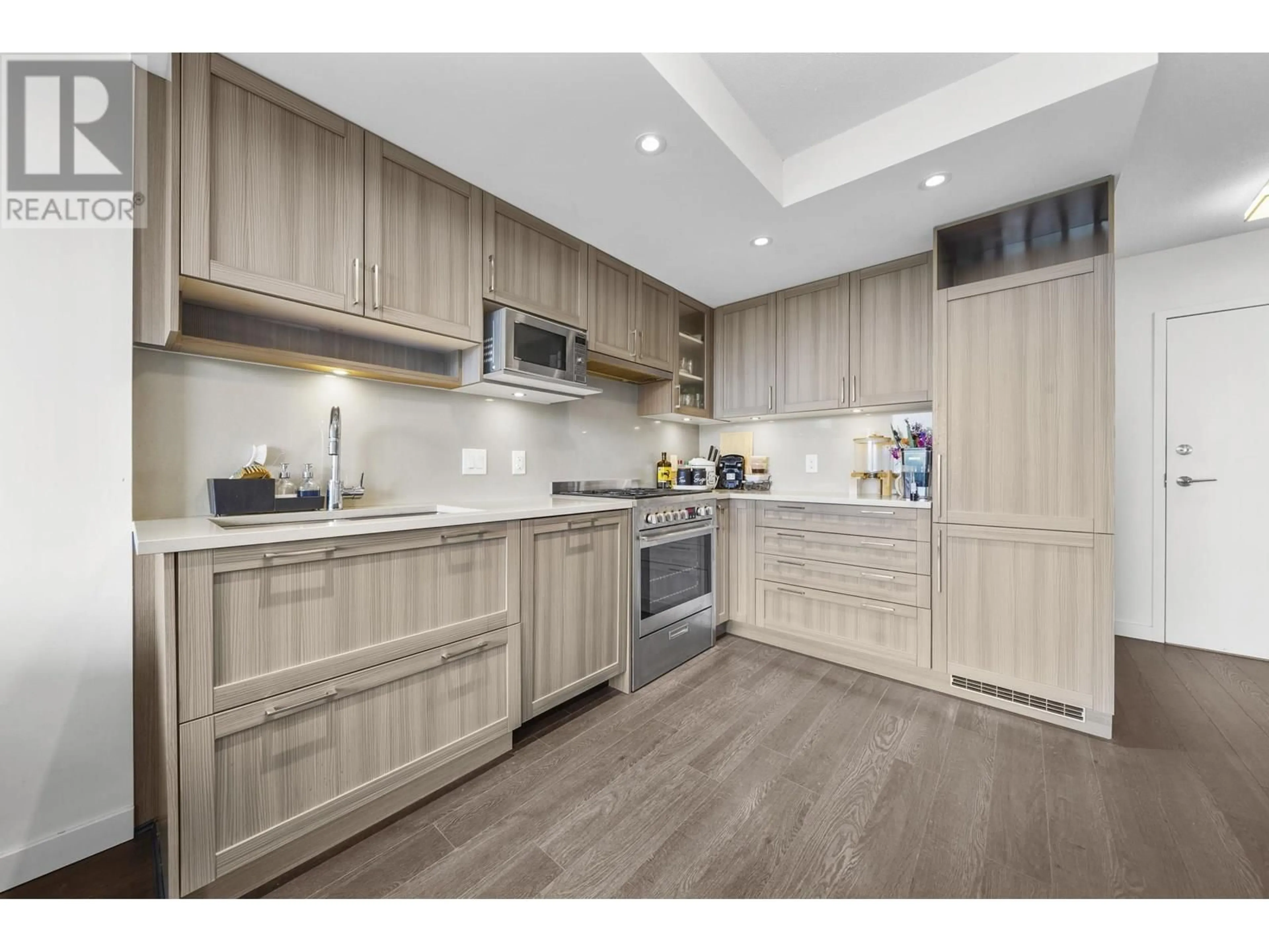 Open concept kitchen, wood/laminate floor for 910 - 5470 ORMIDALE STREET, Vancouver British Columbia V5R0G6