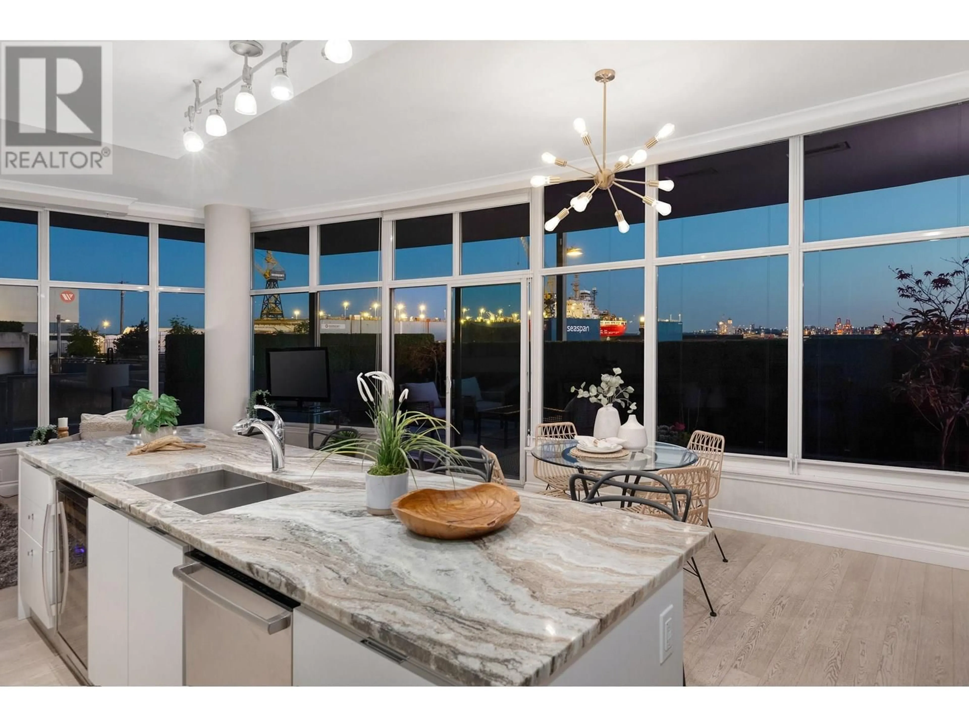 Open concept kitchen, ceramic/tile floor for 105 - 175 VICTORY SHIP WAY, North Vancouver British Columbia V7L0G1