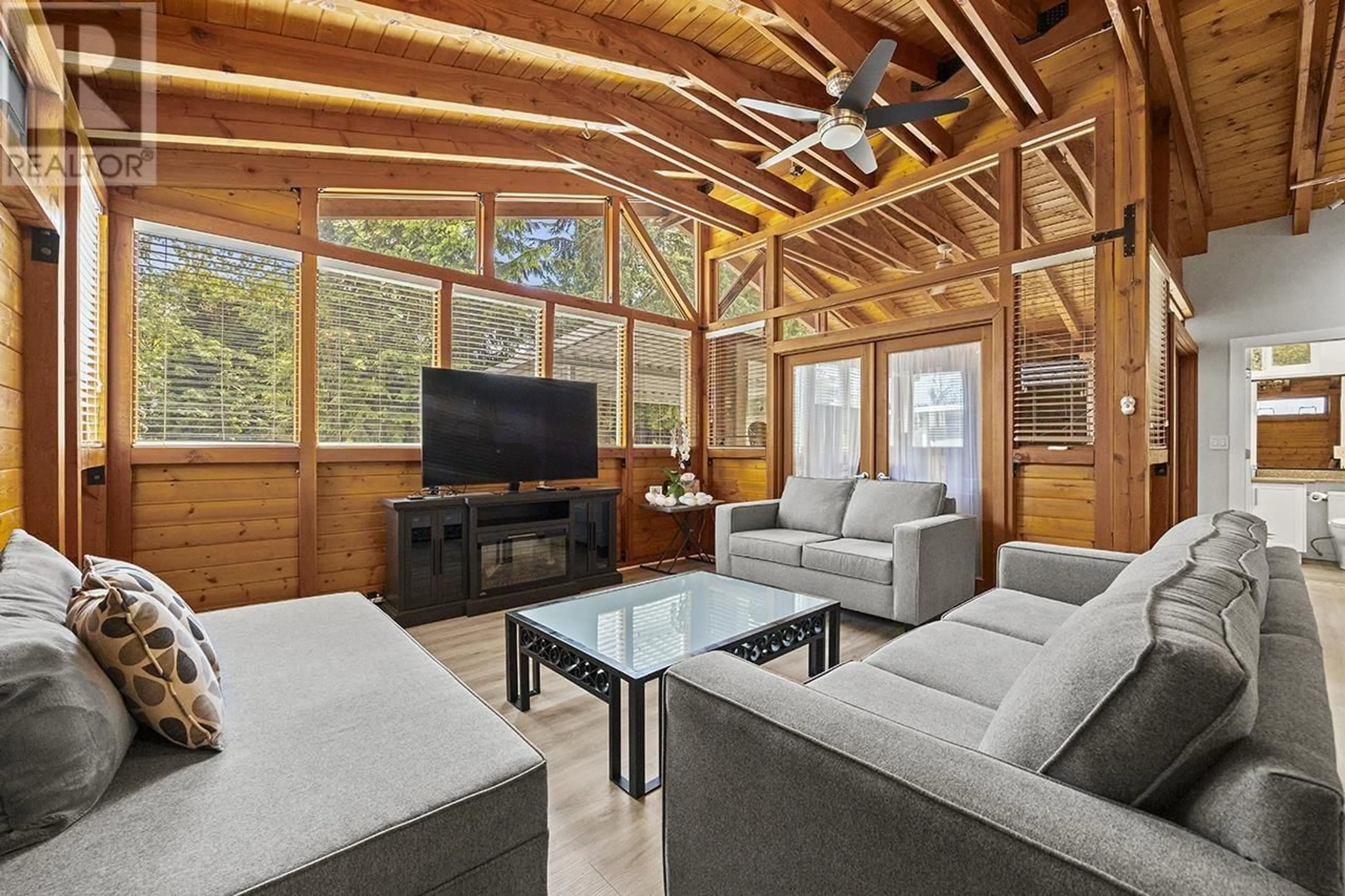 Living room with furniture, wood/laminate floor for 7983 SUNCREST DRIVE, Burnaby British Columbia V5J3N4