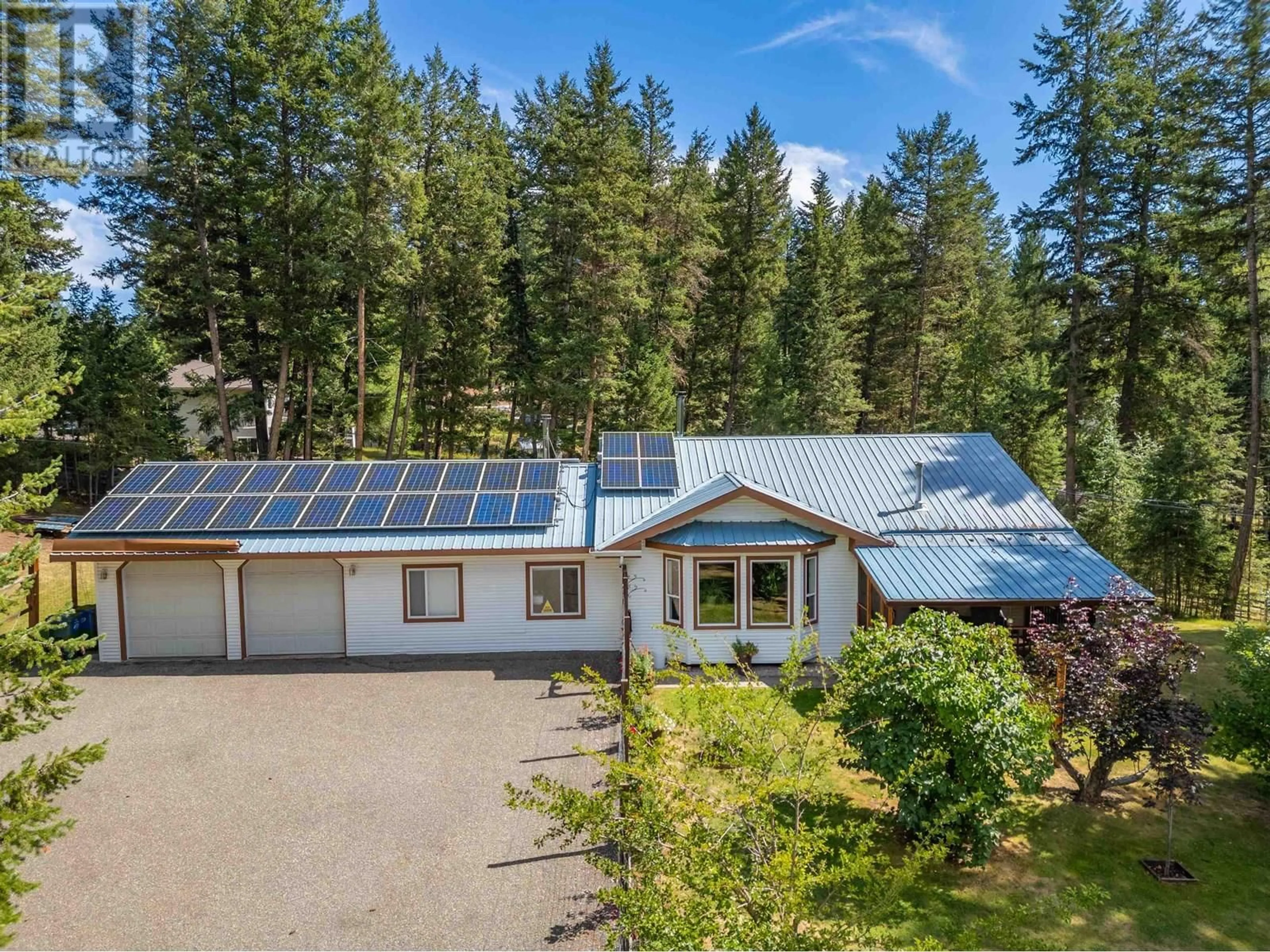 A pic from outside/outdoor area/front of a property/back of a property/a pic from drone, unknown for 5208 DAVIS ROAD, 108 Mile Ranch British Columbia V0K2Z0