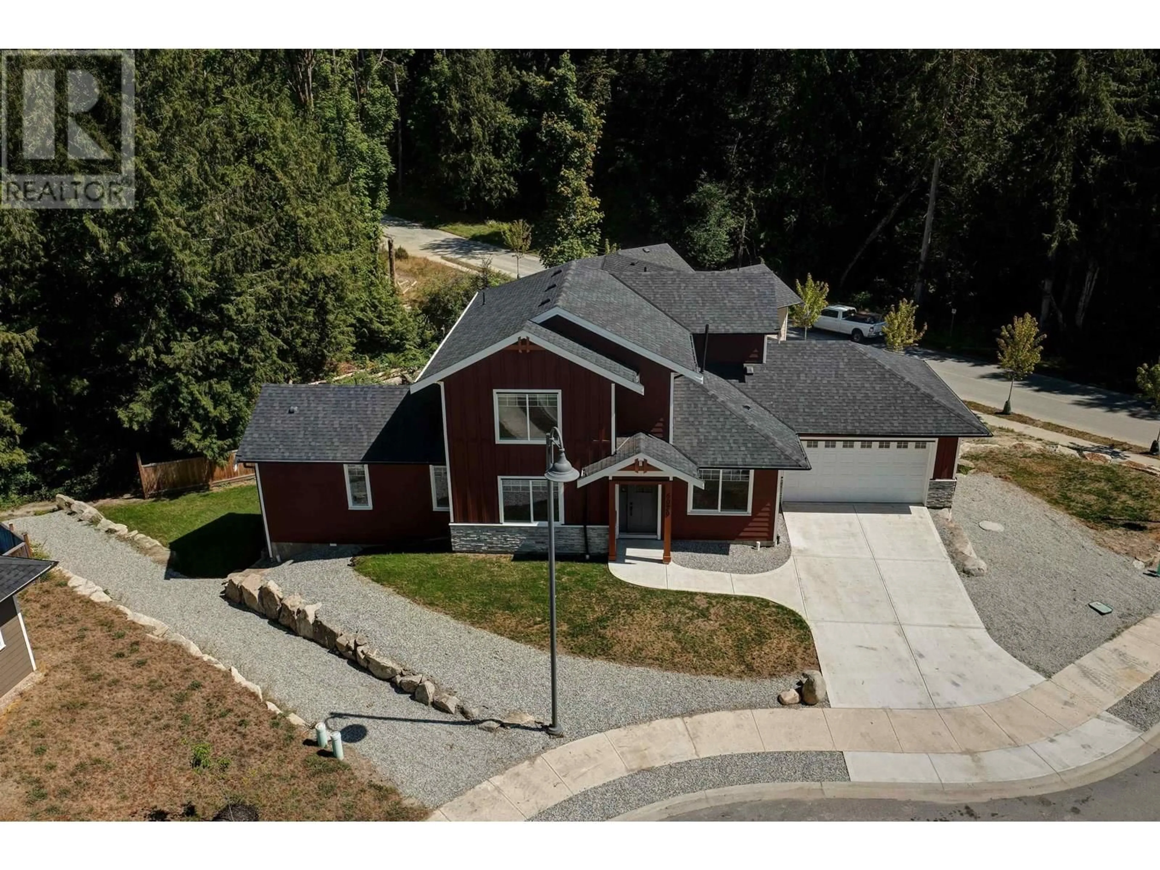 A pic from outside/outdoor area/front of a property/back of a property/a pic from drone, street for 6072 HEARTWOOD PLACE, Sechelt British Columbia V7Z0P9