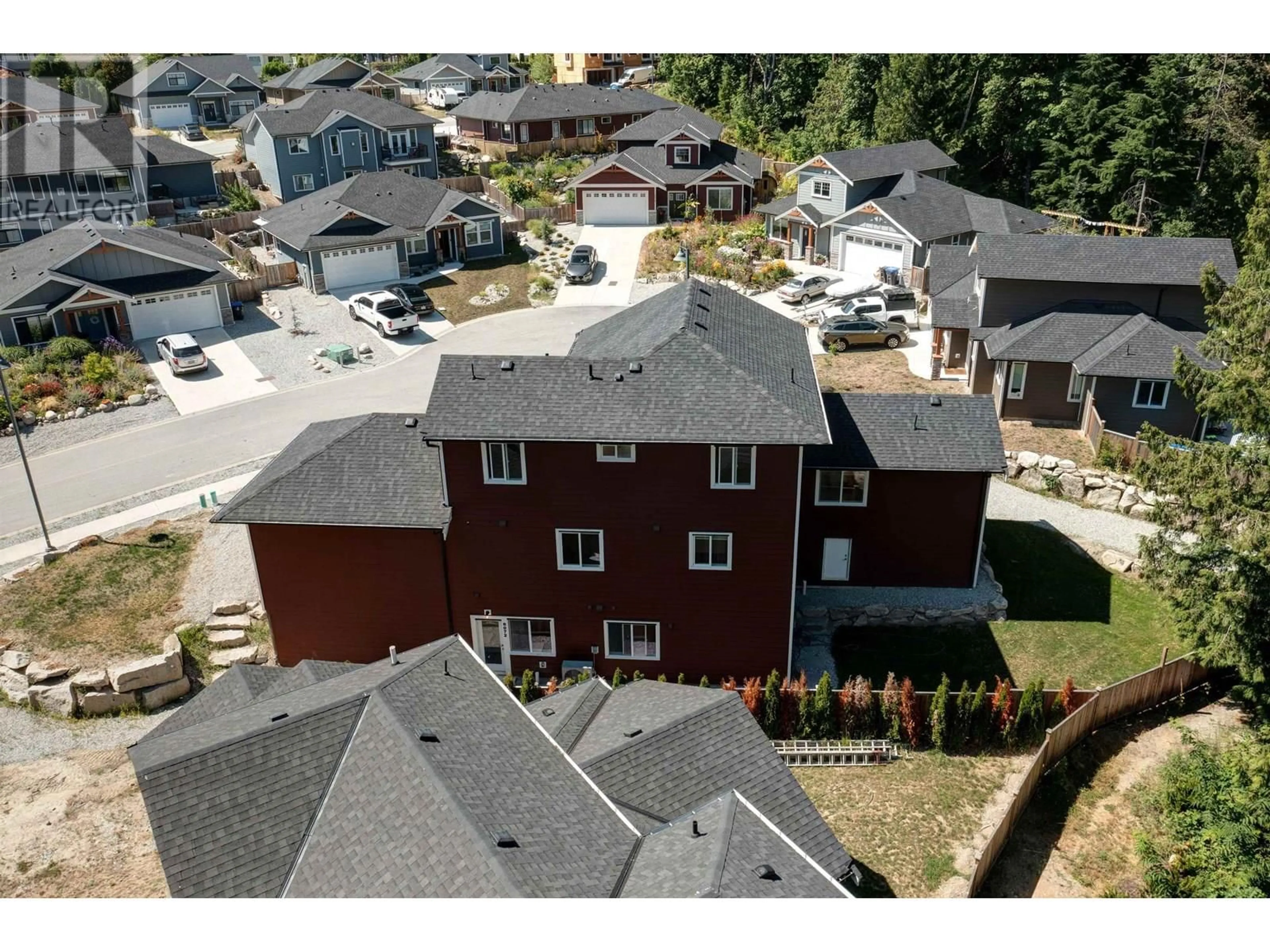 A pic from outside/outdoor area/front of a property/back of a property/a pic from drone, street for 6072 HEARTWOOD PLACE, Sechelt British Columbia V7Z0P9