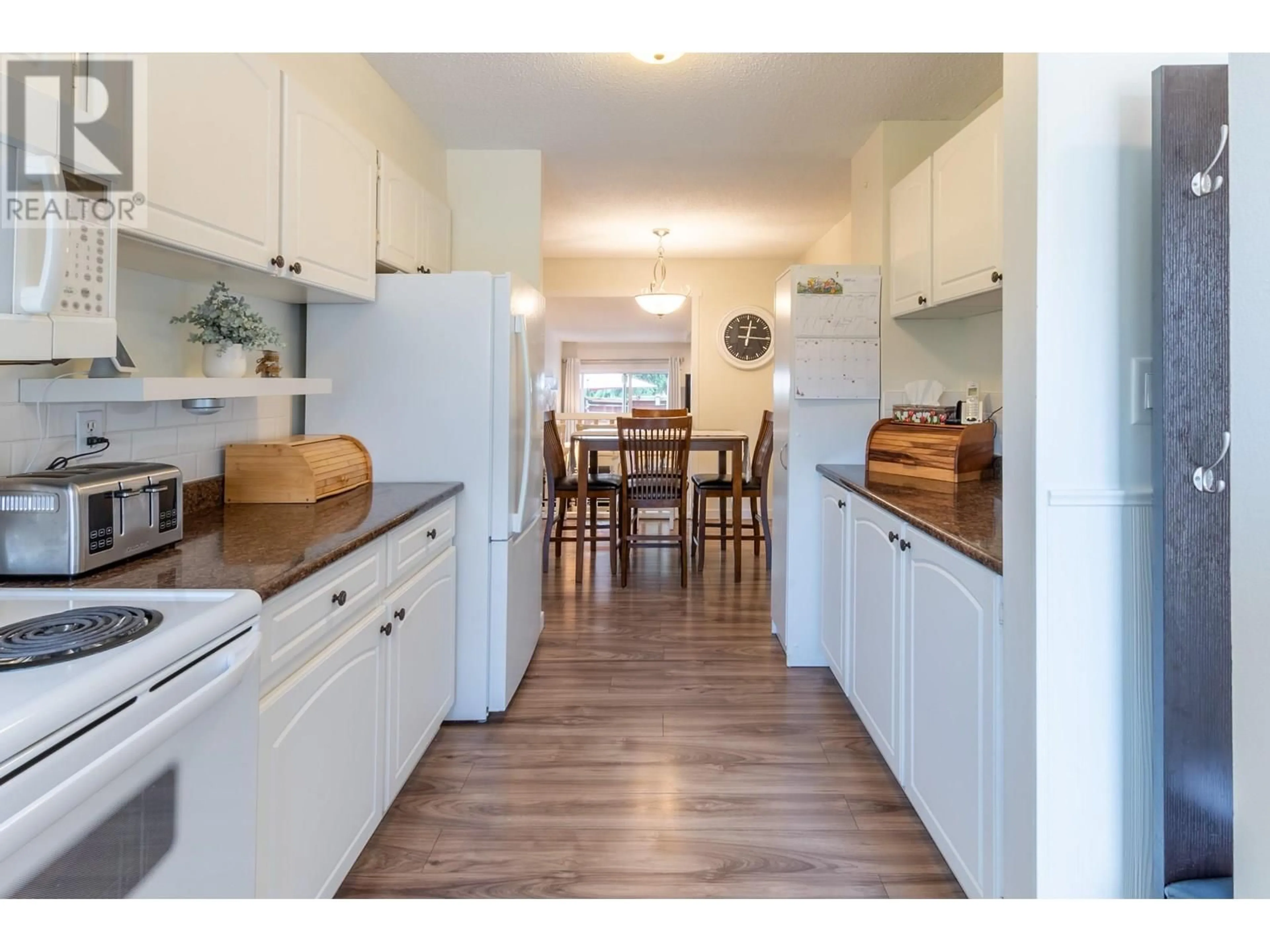 Open concept kitchen, wood/laminate floor for 102 - 101 TABOR BOULEVARD, Prince George British Columbia V2M6Y1