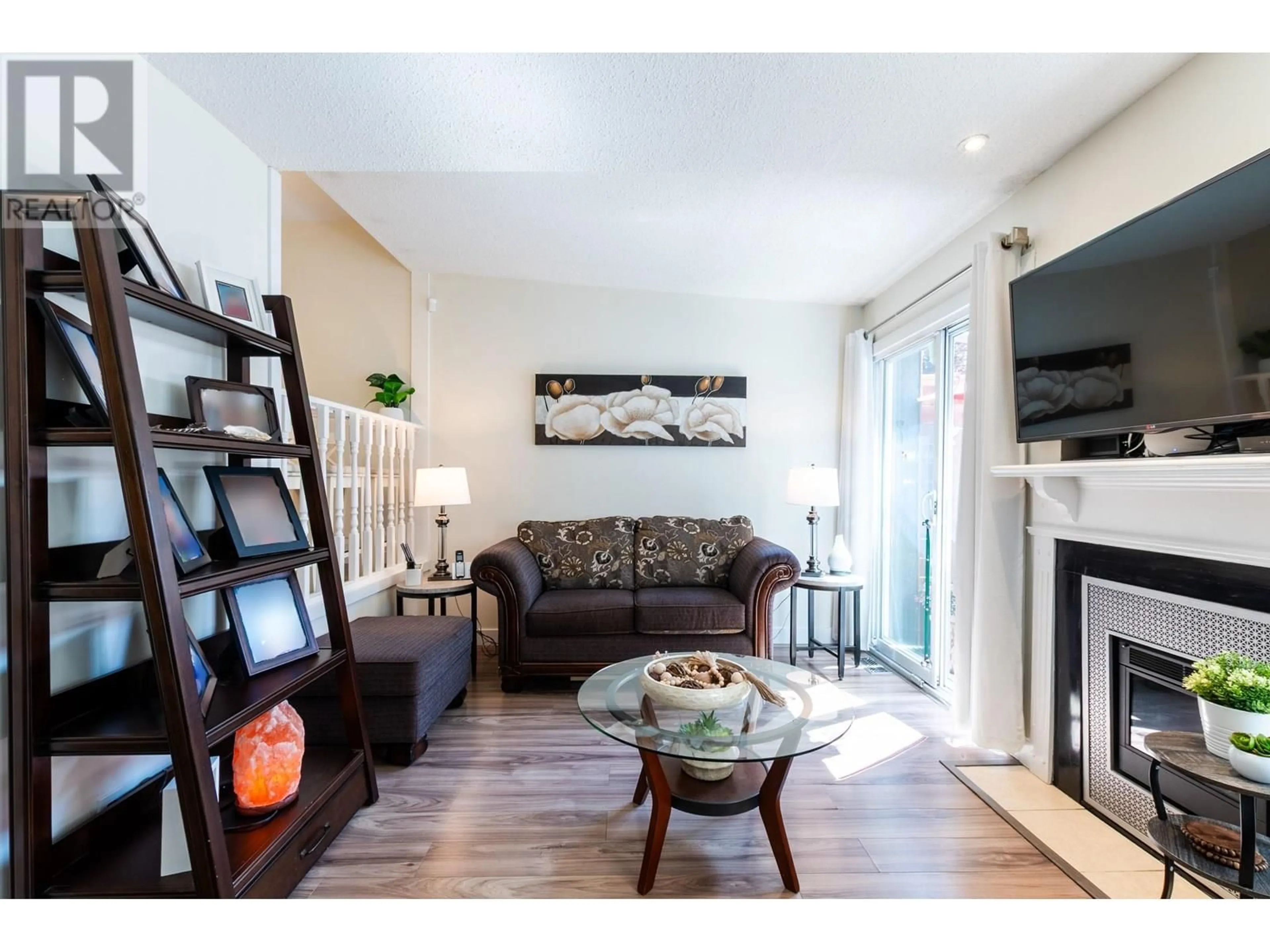 Living room with furniture, wood/laminate floor for 102 - 101 TABOR BOULEVARD, Prince George British Columbia V2M6Y1