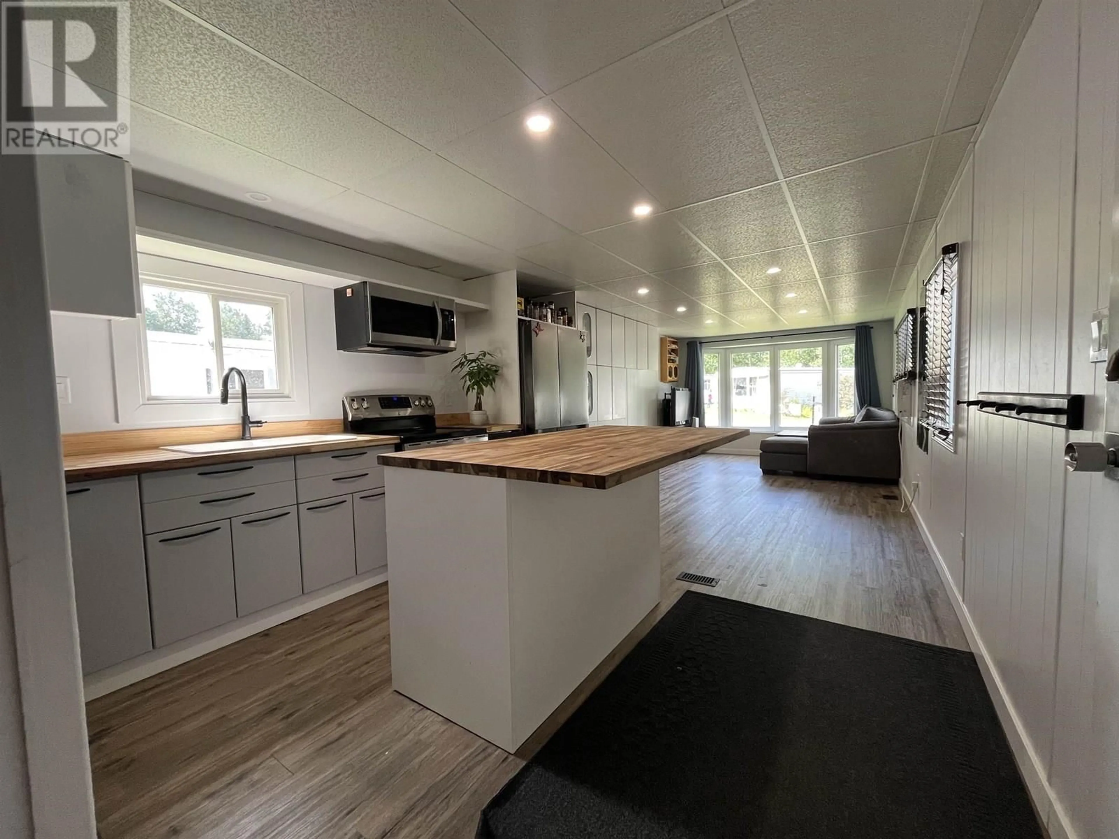 Open concept kitchen, wood/laminate floor for 89 - 6100 DAKELH TI, Prince George British Columbia V2N4R1