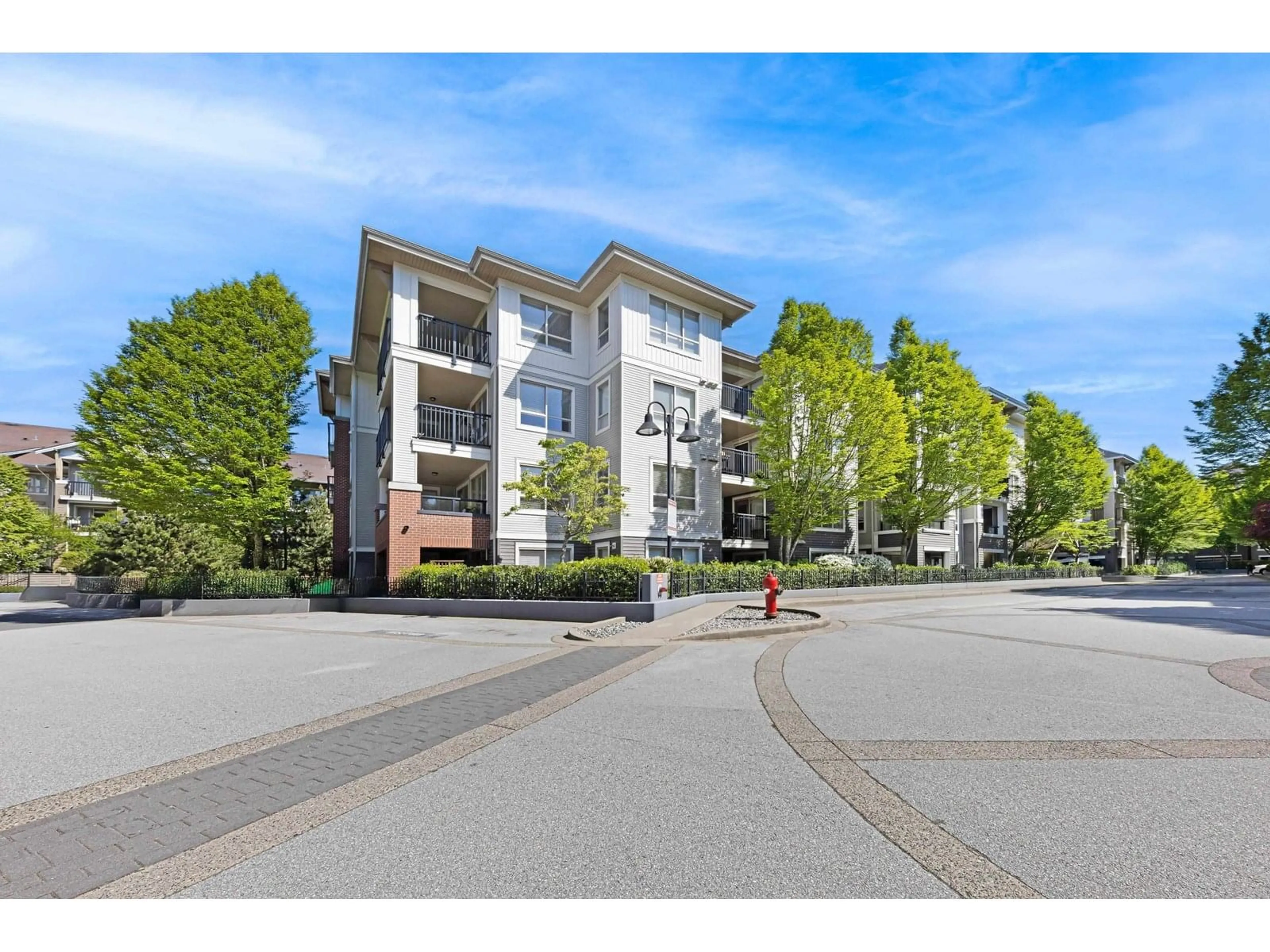 A pic from outside/outdoor area/front of a property/back of a property/a pic from drone, street for A205 - 8929 202, Langley British Columbia V1M0B4