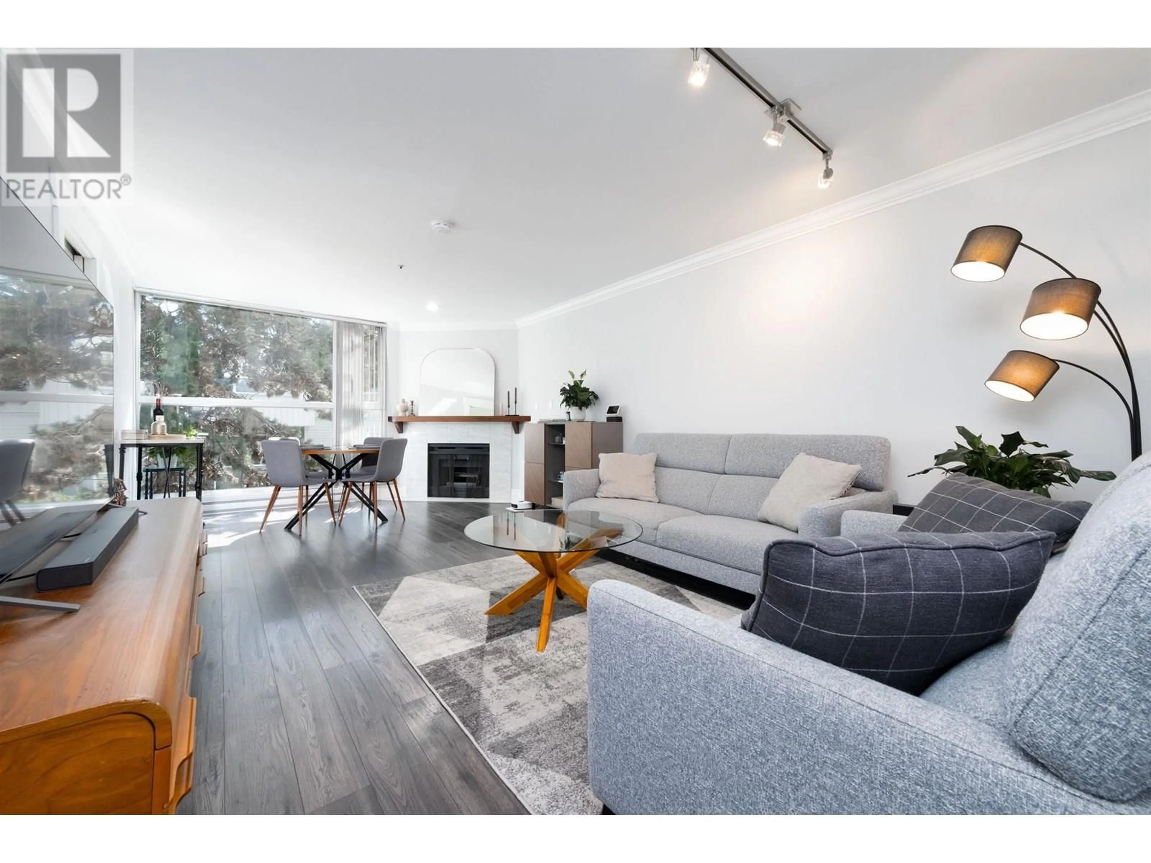 Living room with furniture, wood/laminate floor for 304 - 7700 GILBERT ROAD, Richmond British Columbia V7C3W2
