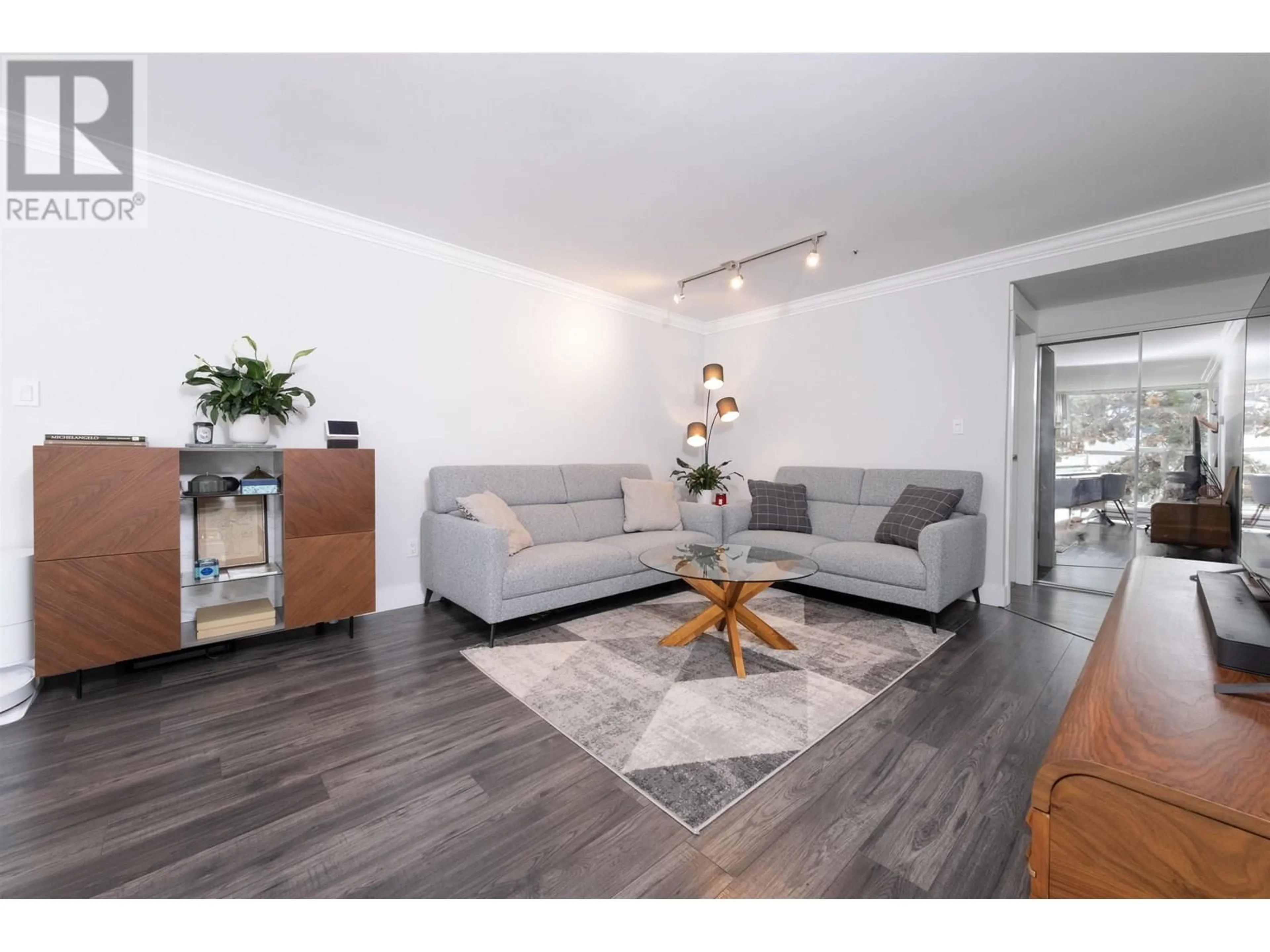 Living room with furniture, wood/laminate floor for 304 - 7700 GILBERT ROAD, Richmond British Columbia V7C3W2