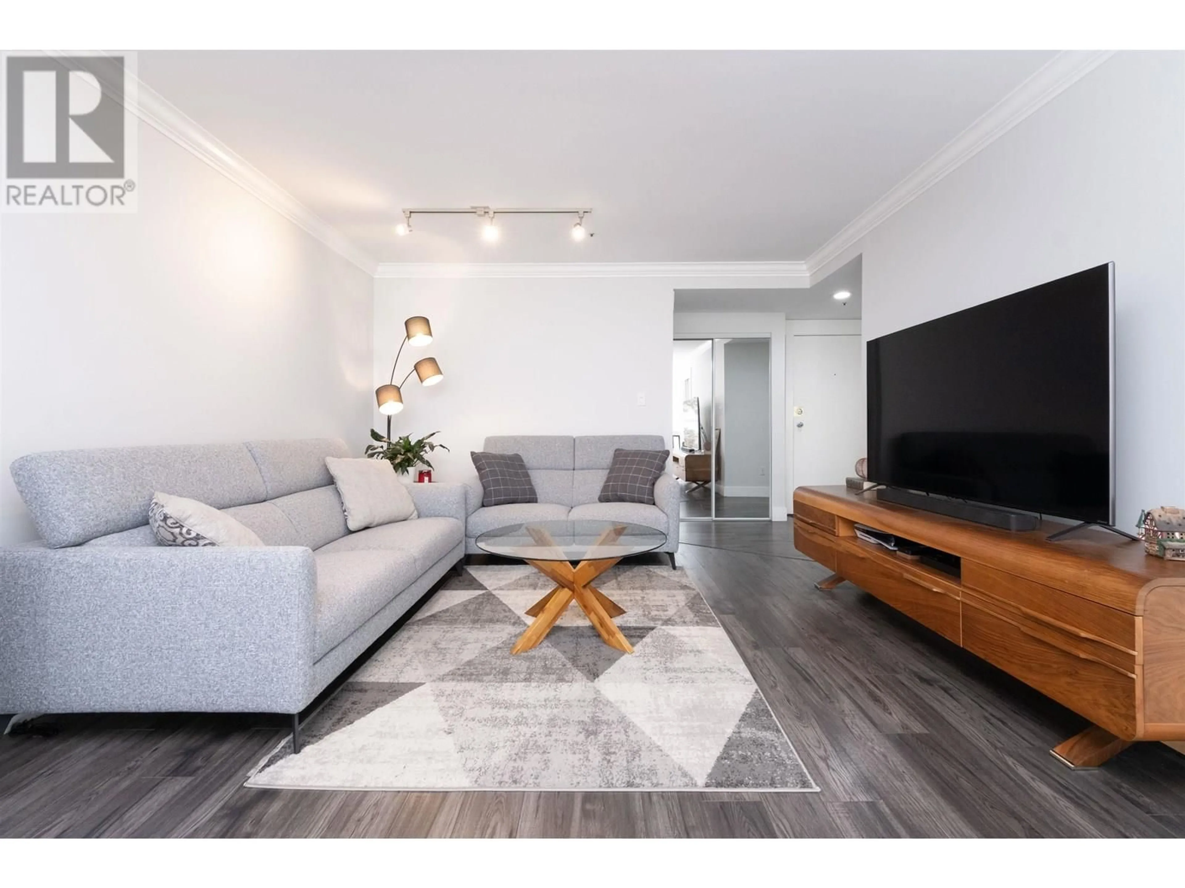 Living room with furniture, wood/laminate floor for 304 - 7700 GILBERT ROAD, Richmond British Columbia V7C3W2