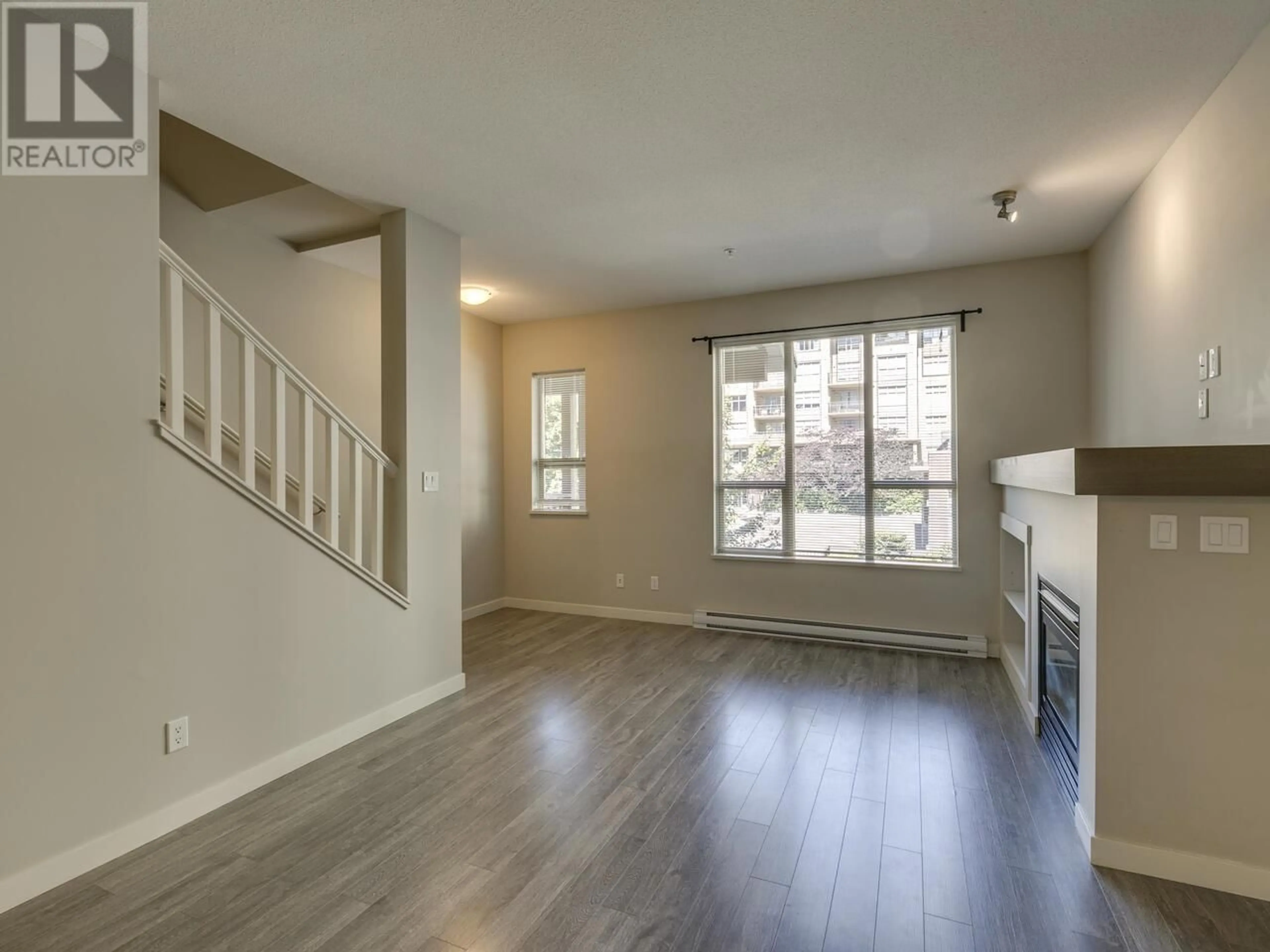 Living room with furniture, wood/laminate floor for 38326 EAGLEWIND BOULEVARD, Squamish British Columbia V8B0R8